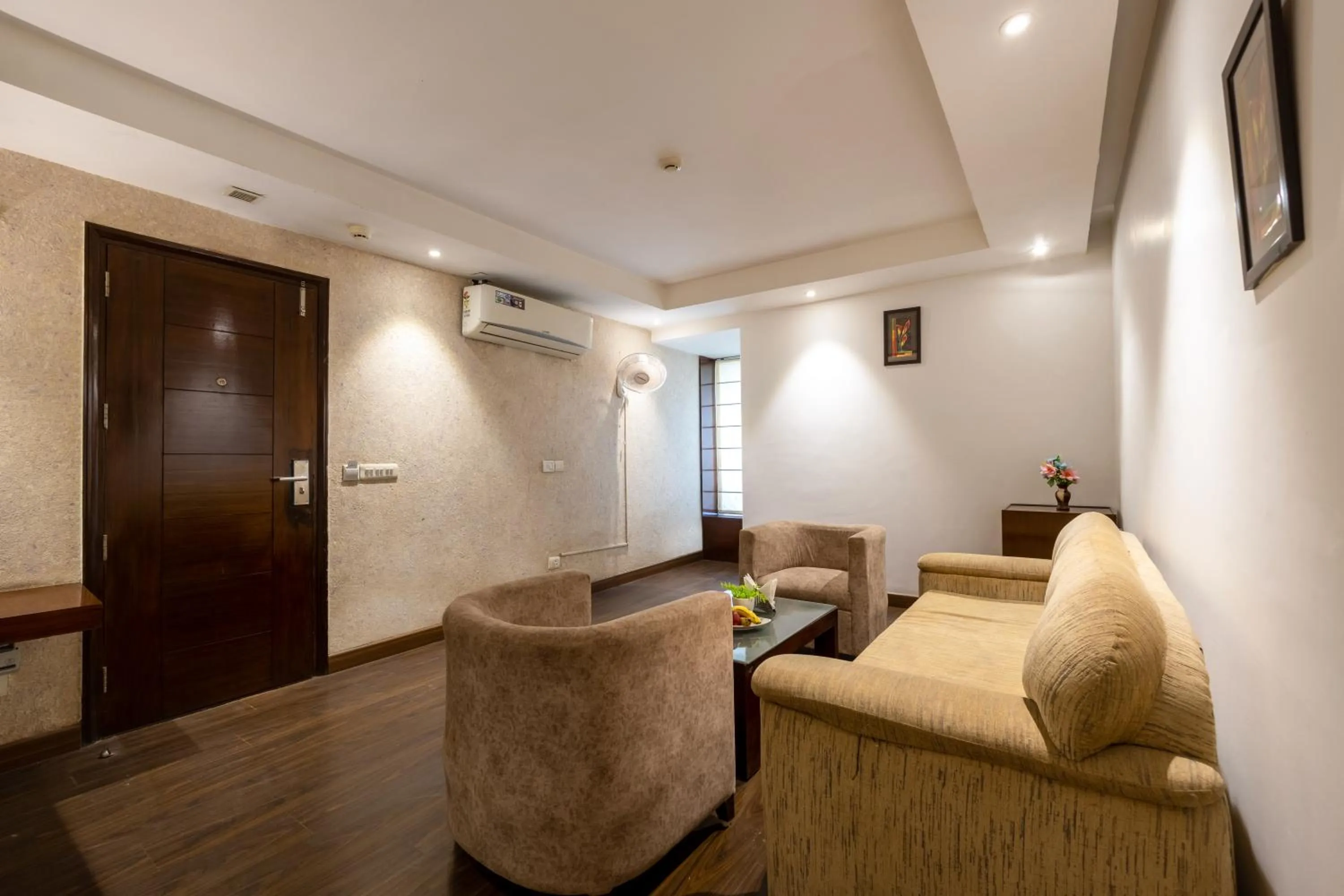 Living room in Hotel Arch Plaza at Yashobhoomi By Arch Group