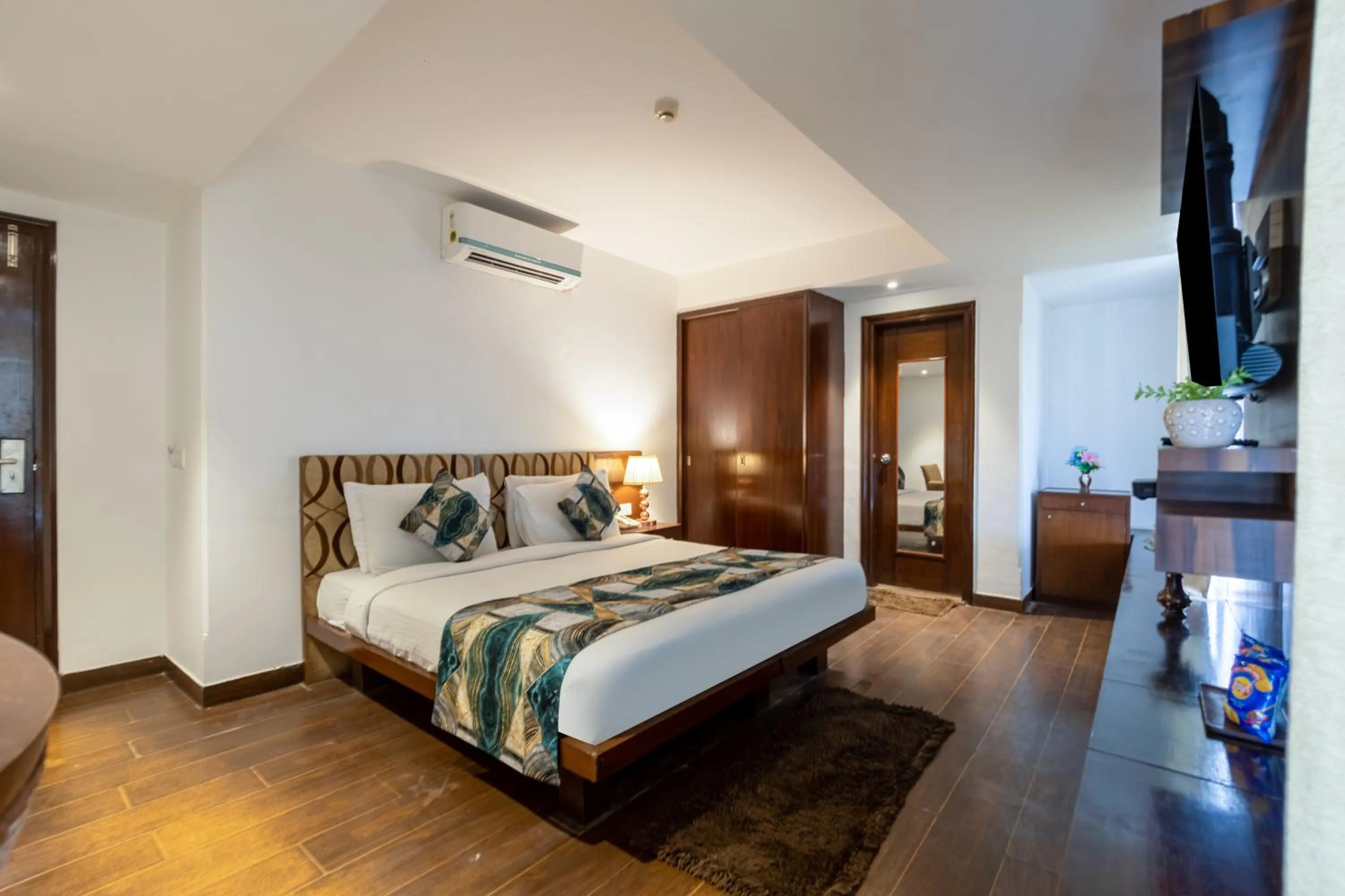 Bed in Hotel Arch Plaza at Yashobhoomi By Arch Group