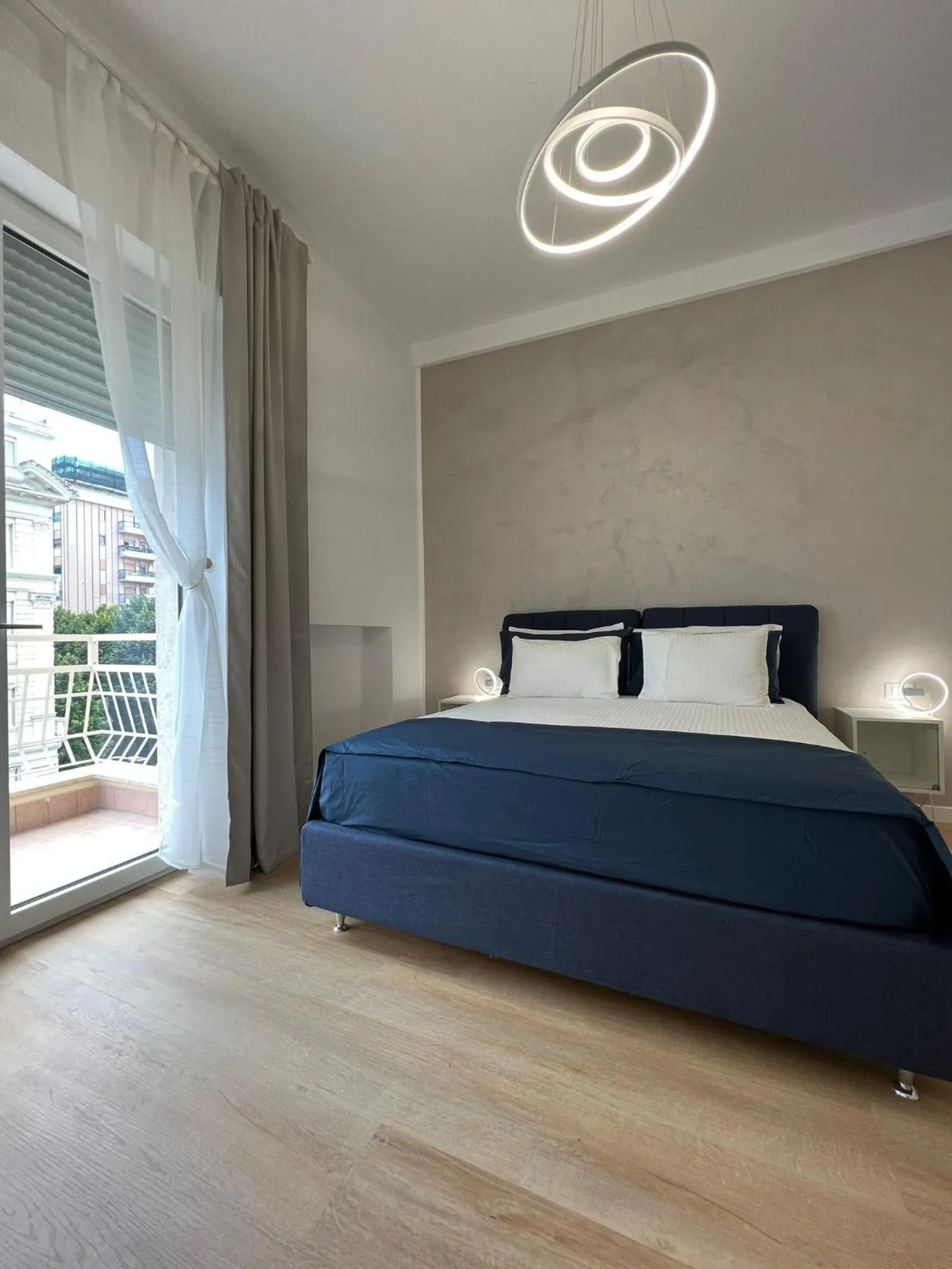 Bed in Blu Apartment