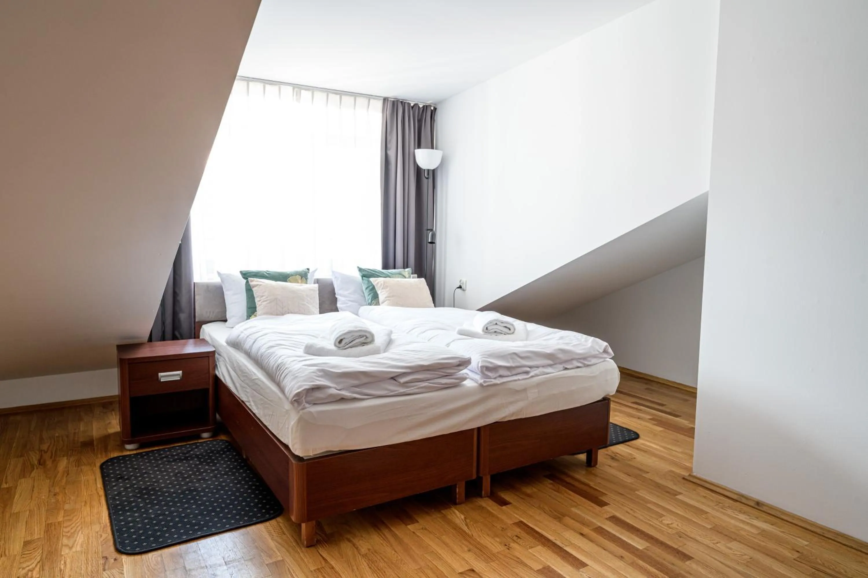 Bed in ON/SET APARTHOTEL