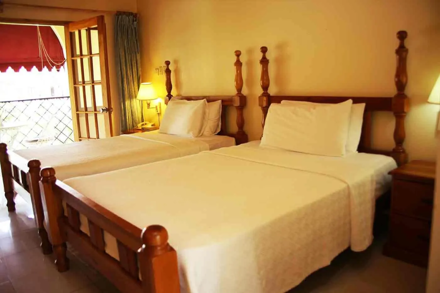 Bed in Charela Inn