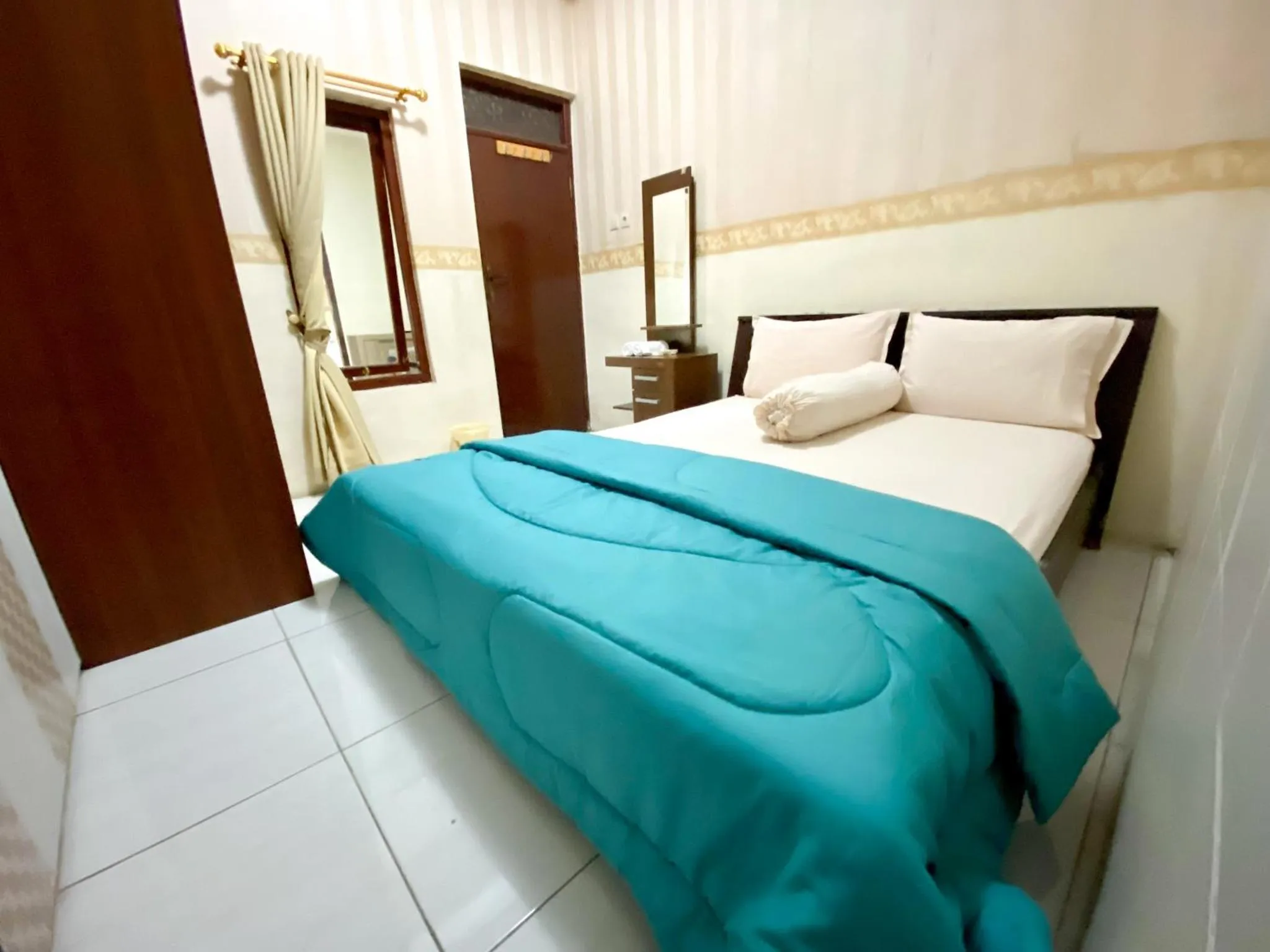 Bedroom in Homey Guesthouse near Sby Zoo Syariah