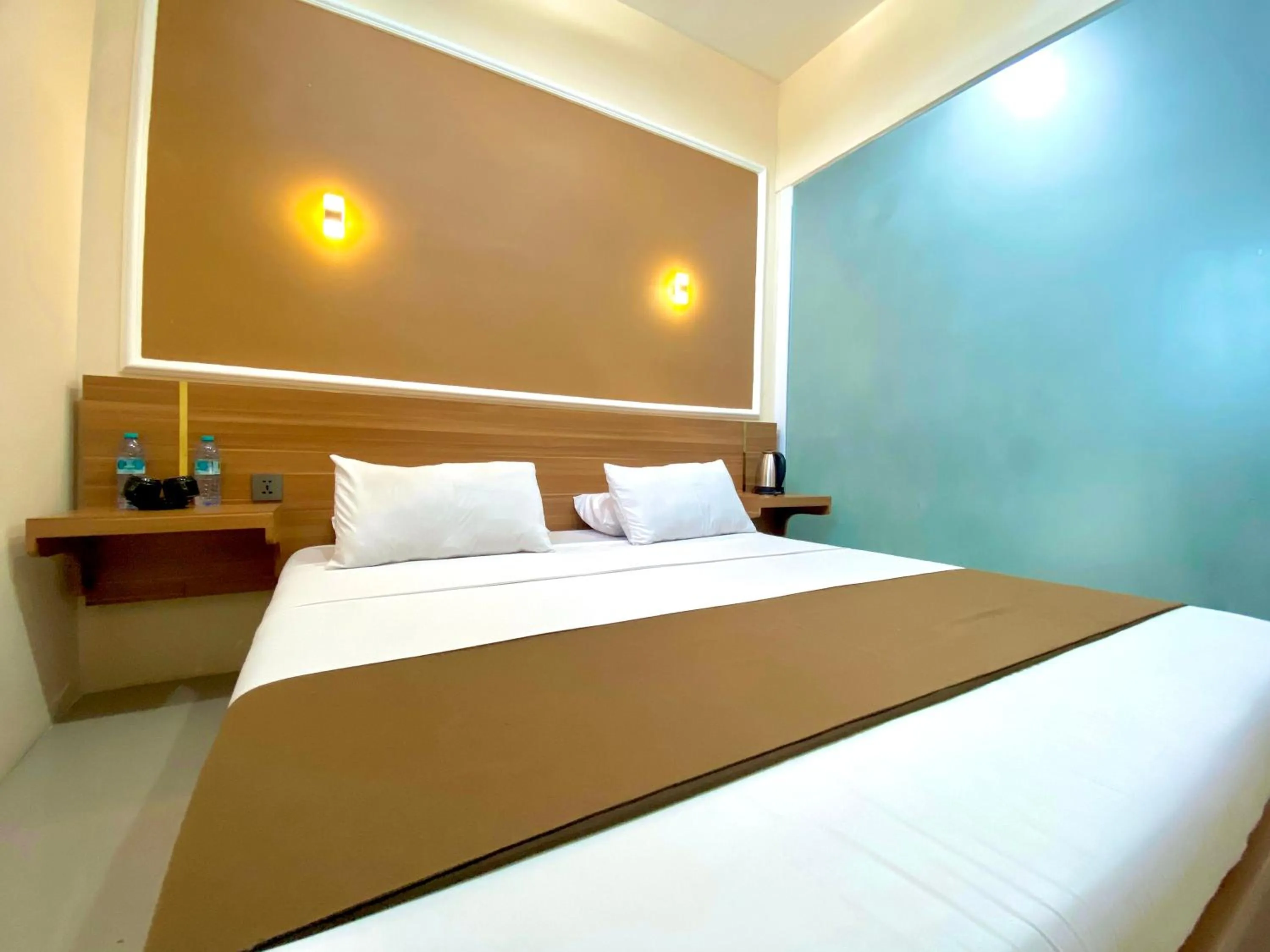 Bed in Al-Kiswah Syariah Guest House
