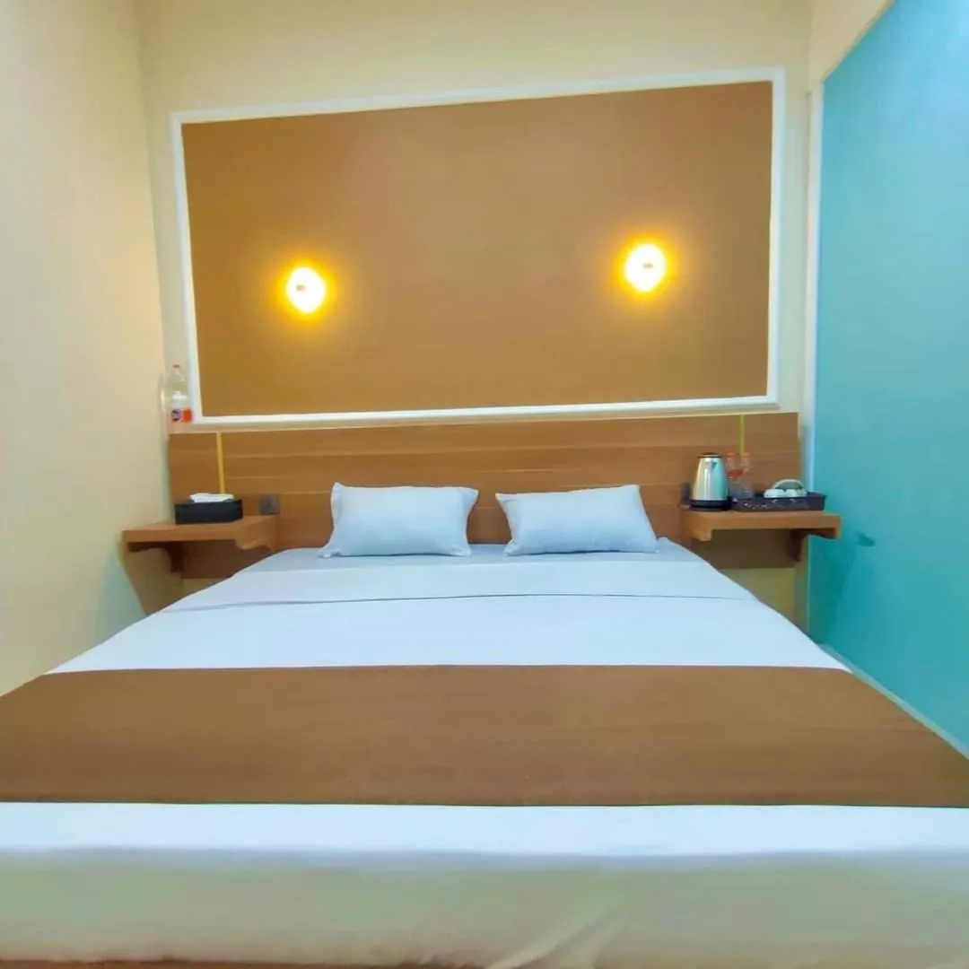 Bed in Al-Kiswah Syariah Guest House
