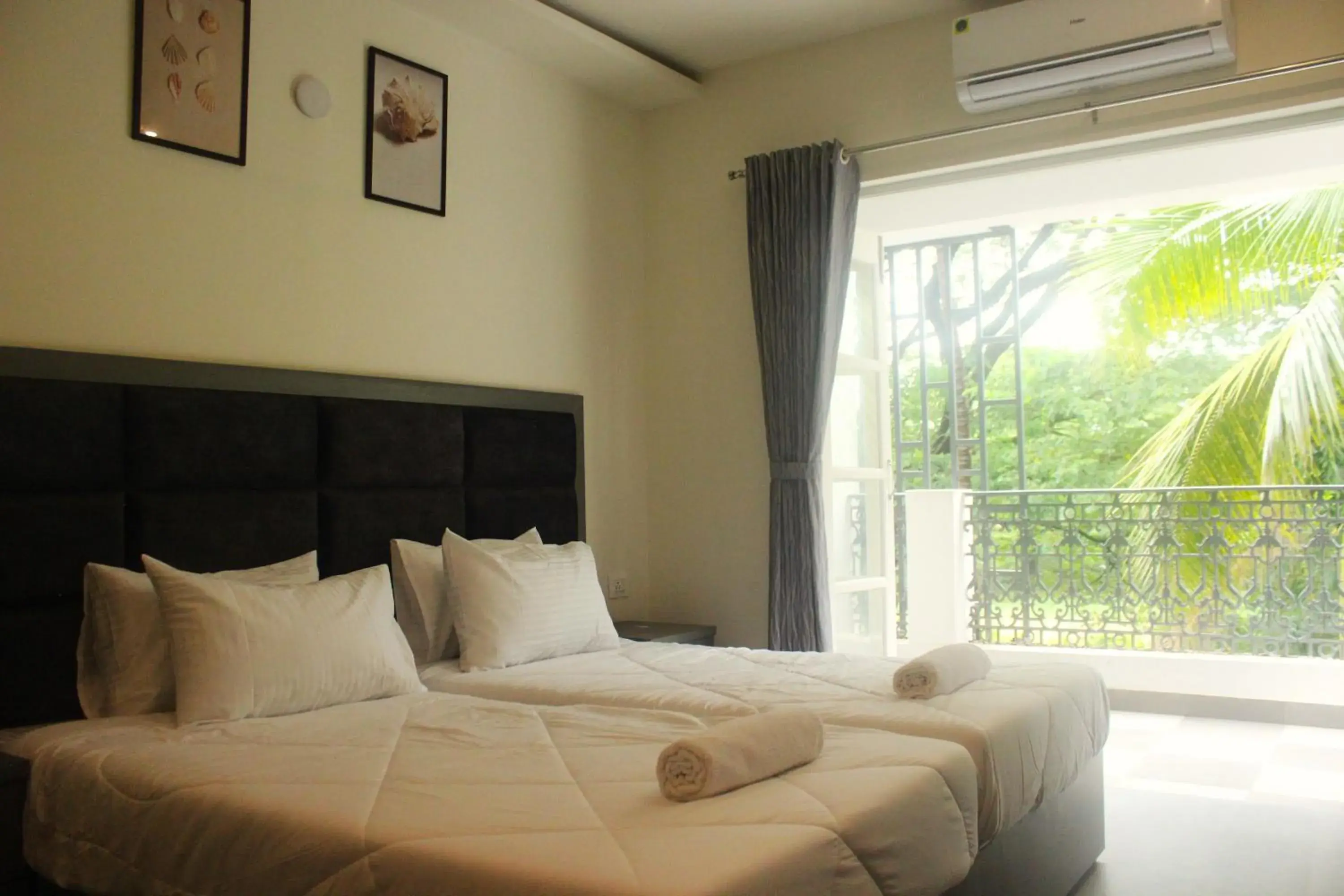 Balcony/Terrace, Bed in Coastal Pearl Hotel Miramar Panaji Balcony/Terrace, Bed in Coastal Pearl Hotel Miramar Panaji