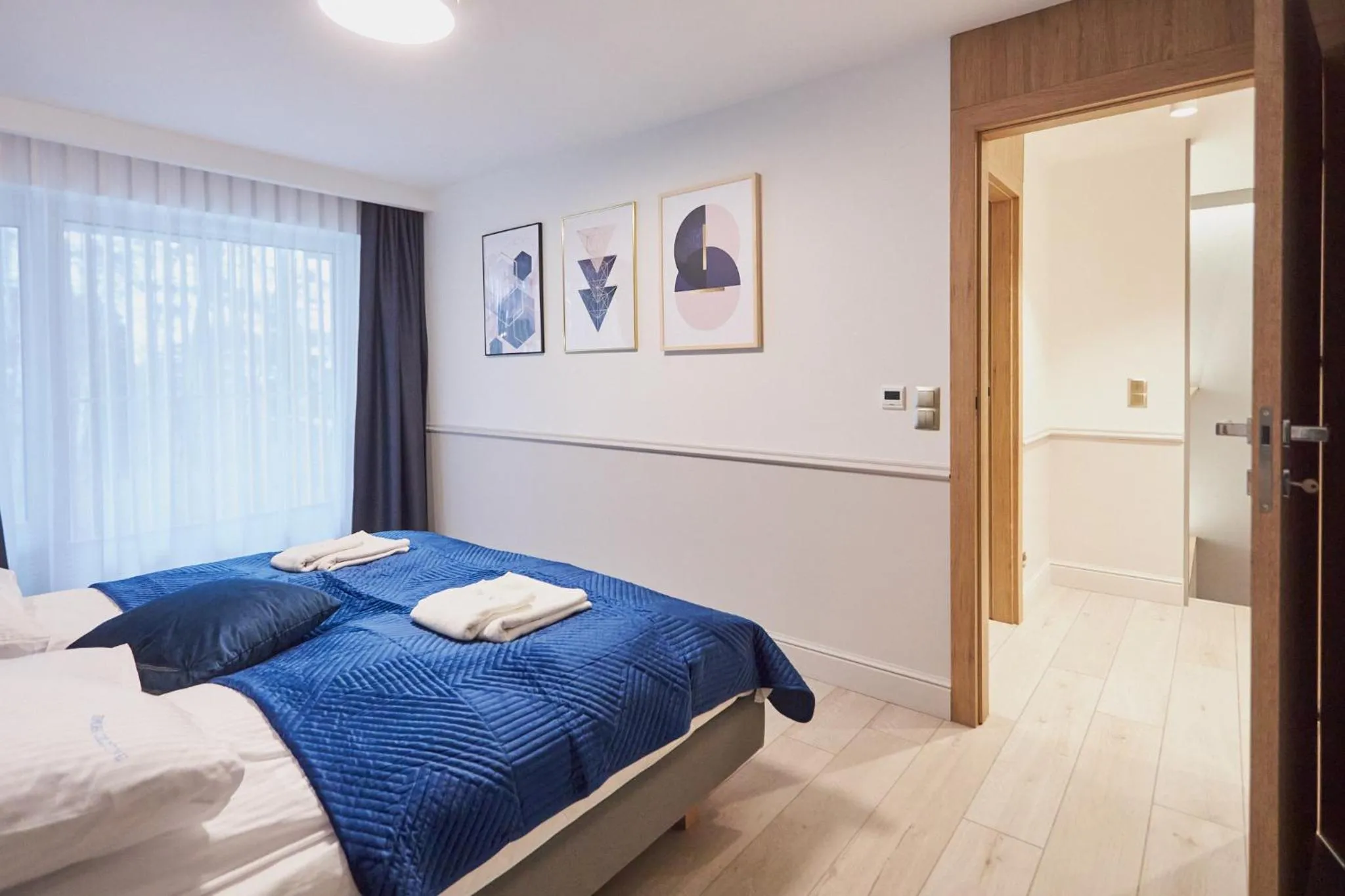 Bed in Timber Apartments by Baltic Home