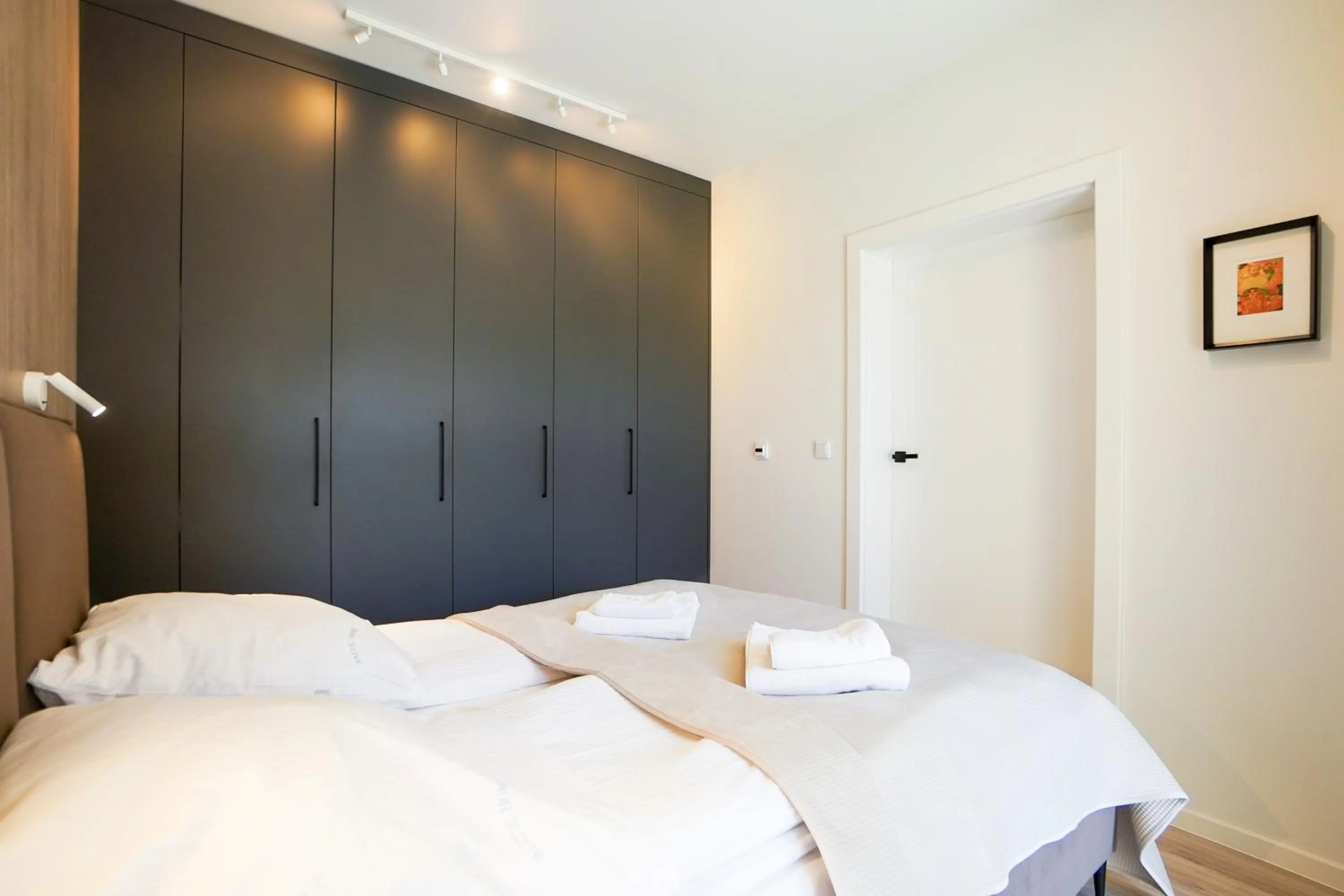 Bed in Timber Apartments by Baltic Home