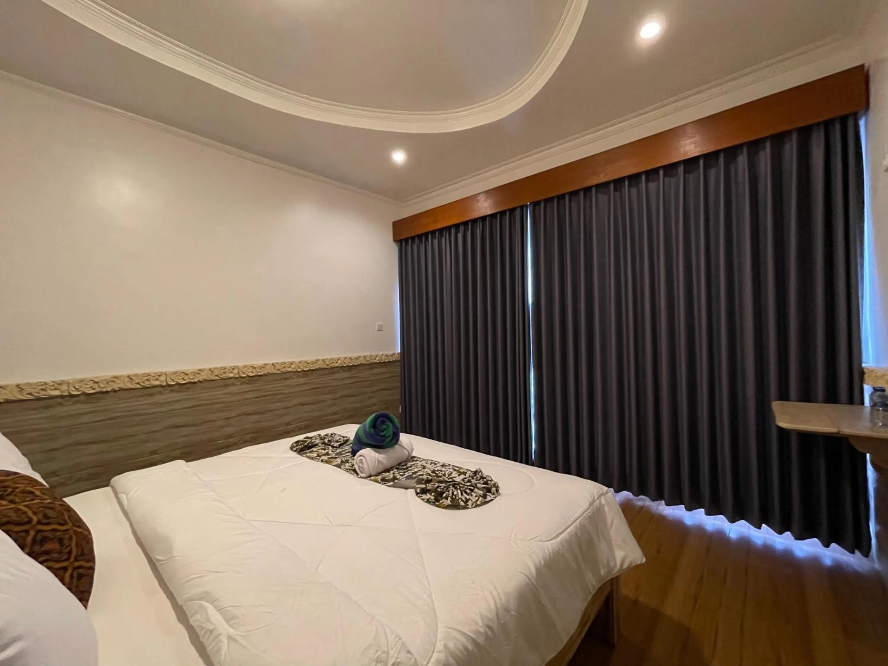 Bed in Mikuk Cottages Canggu