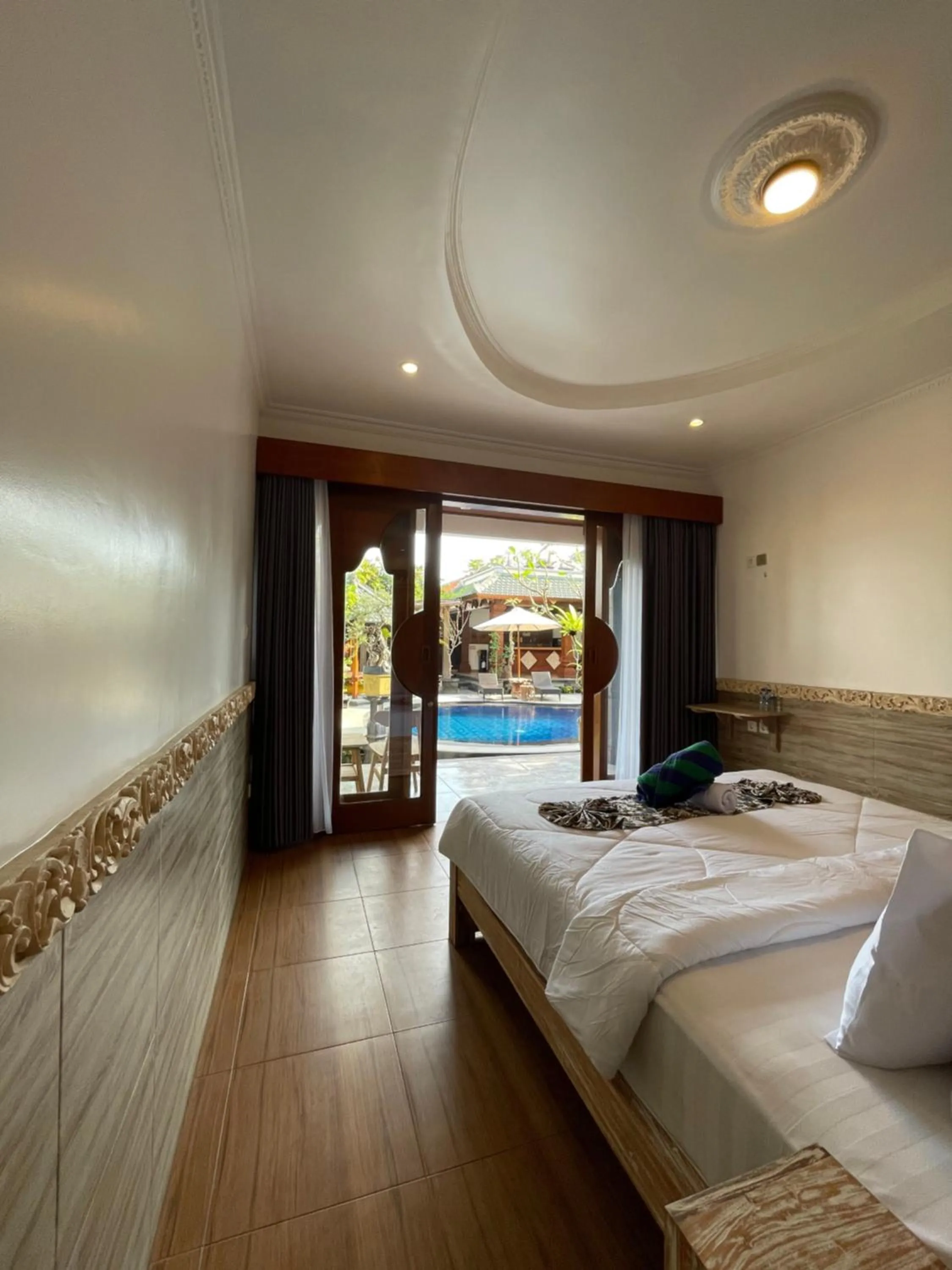 Bed in Mikuk Cottages Canggu