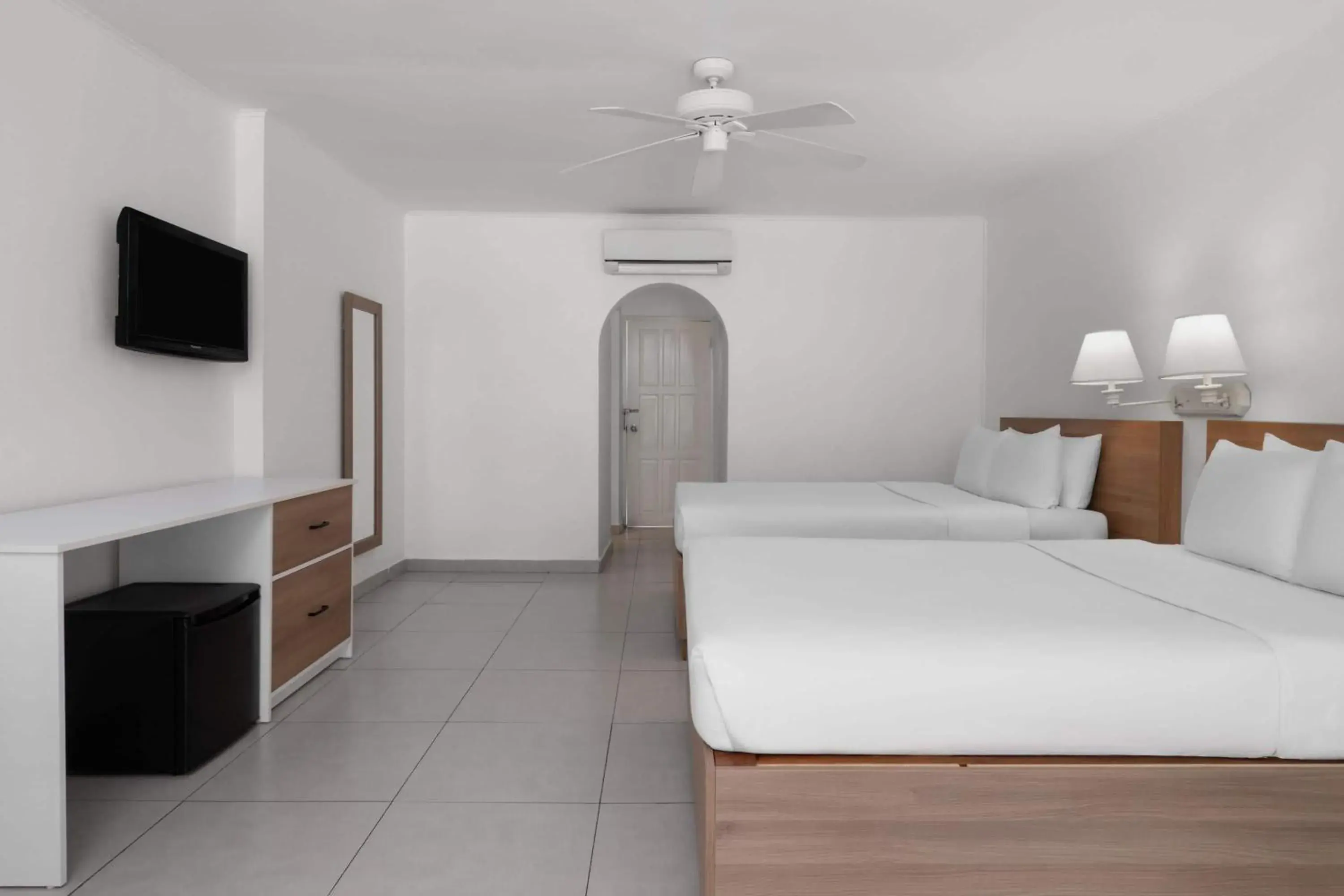 Bed in Grand Decameron Montego Beach, A Trademark All-Inclusive Resort Bed in Grand Decameron Montego Beach, A Trademark All-Inclusive Resort