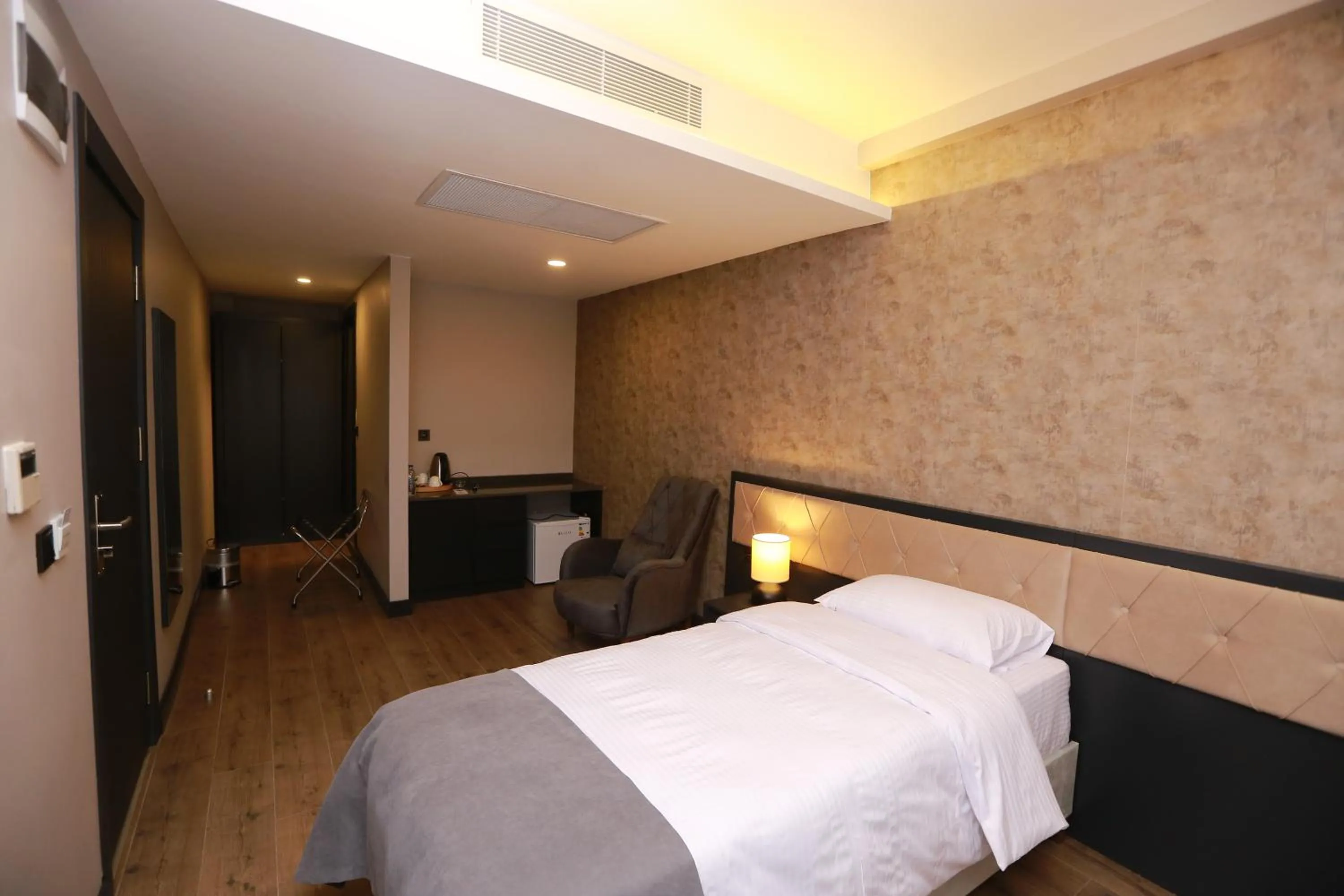 Bed in PENTAHOR HOTEL