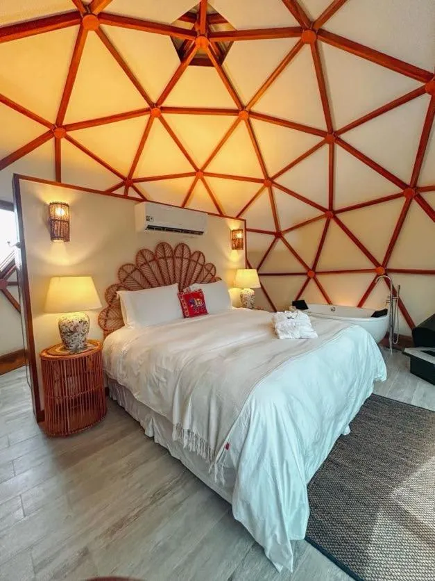 Bed in Embaúba Boutique Hotel