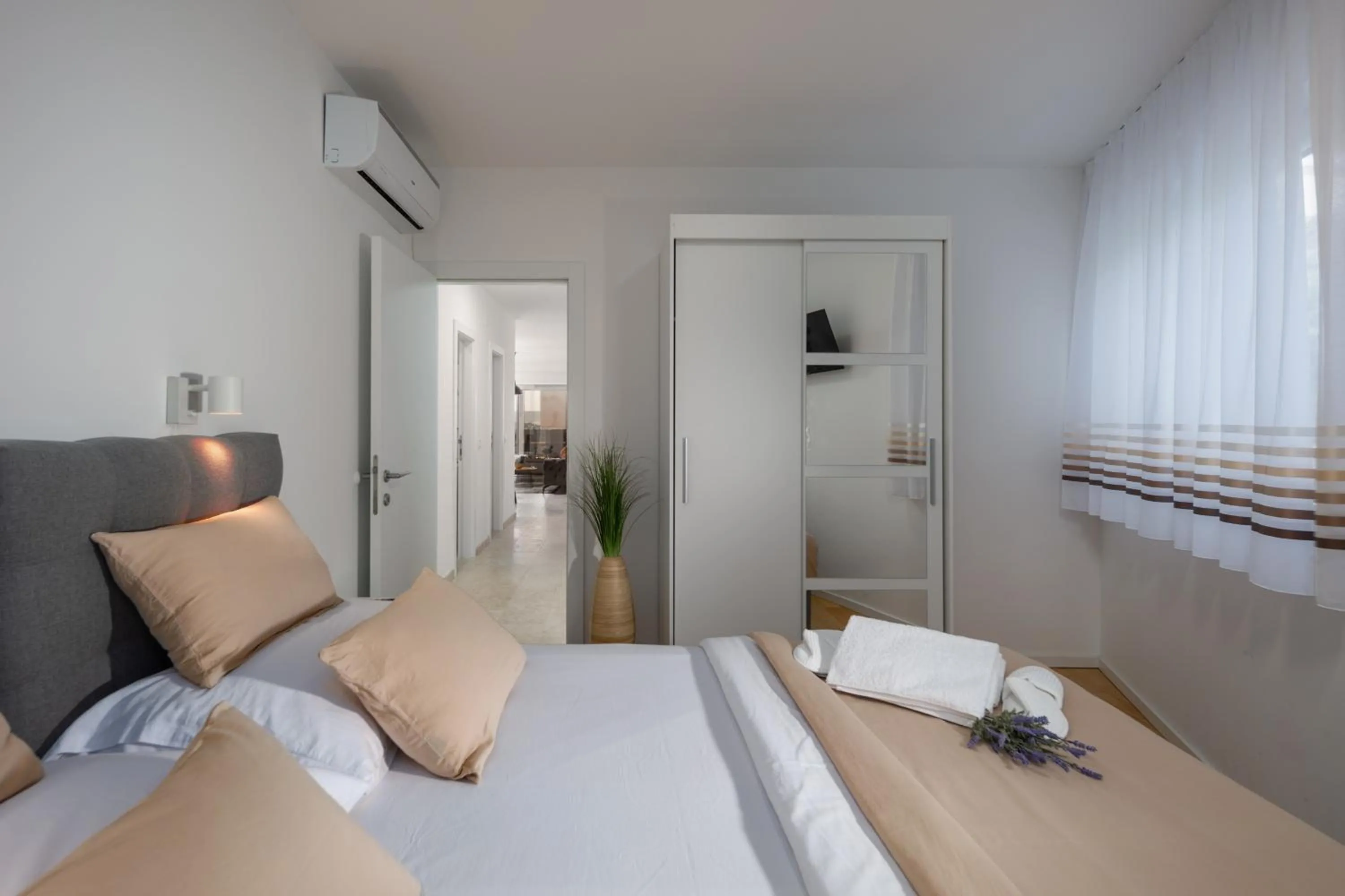 Bed in Luxury apartment Marco Polo with a private swimming pool with salt sea water
