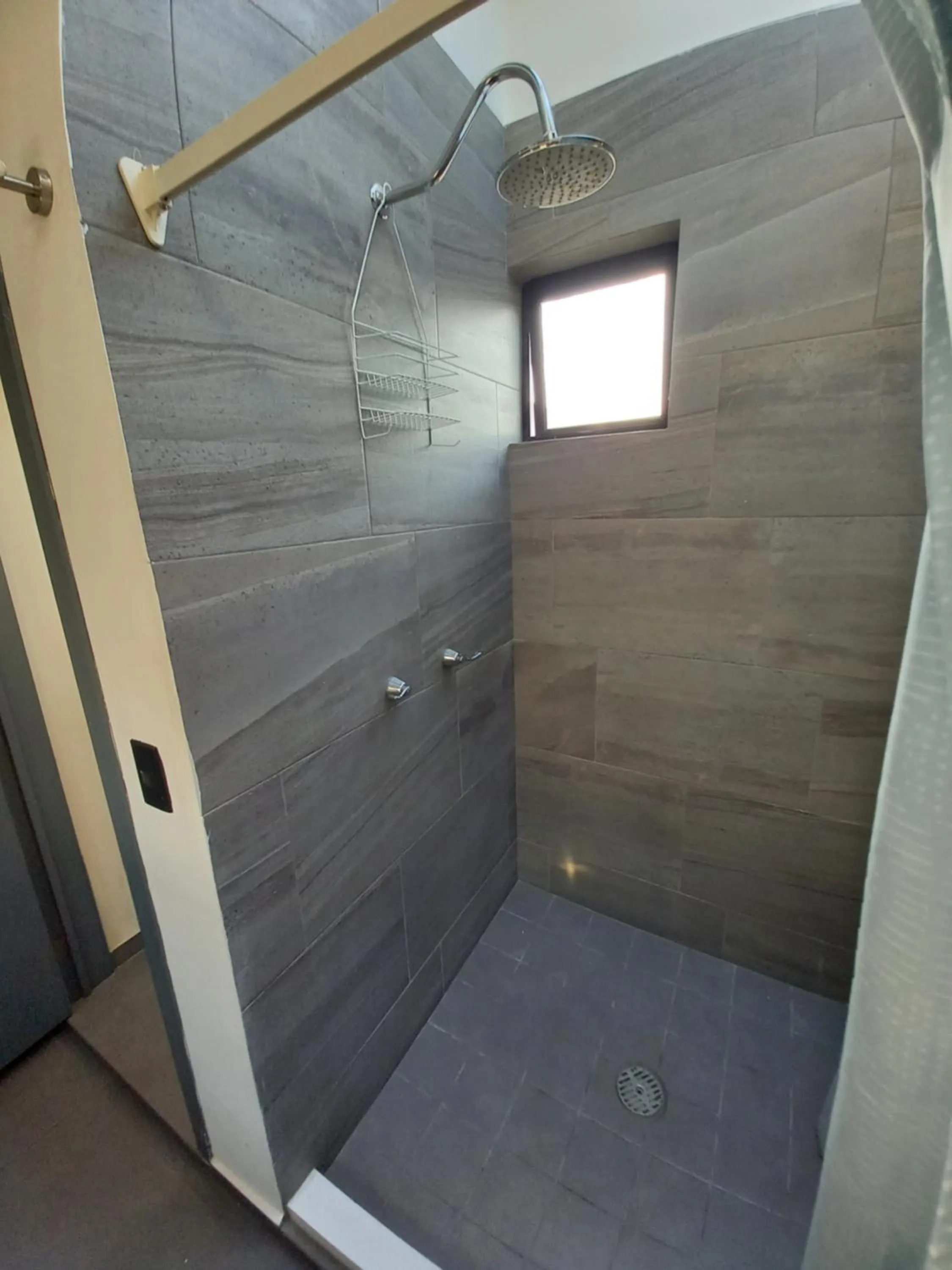 Shower in Capital O Tu Estancia