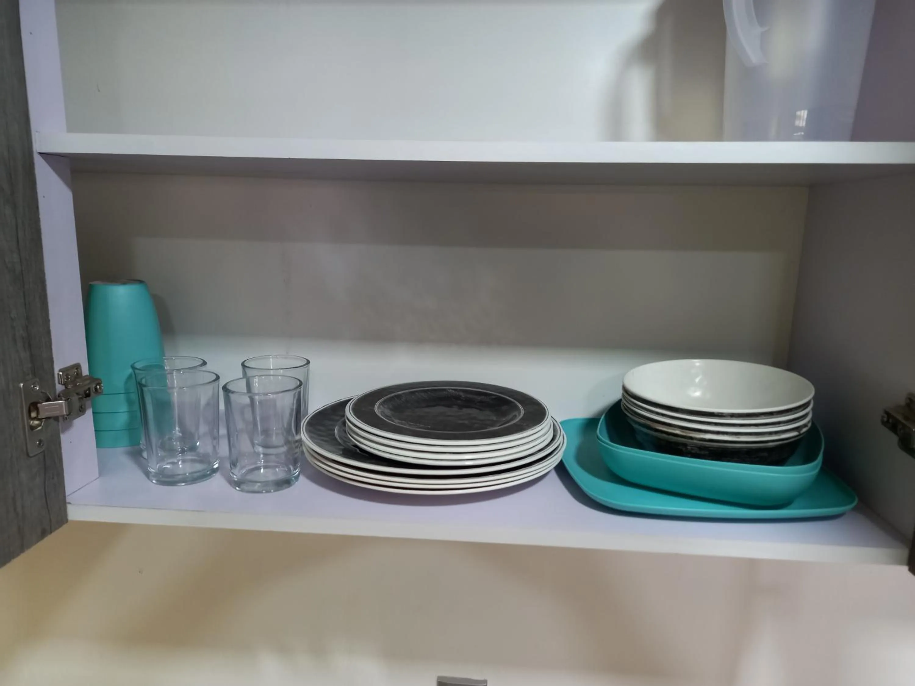 Kitchen or kitchenette in Capital O Tu Estancia