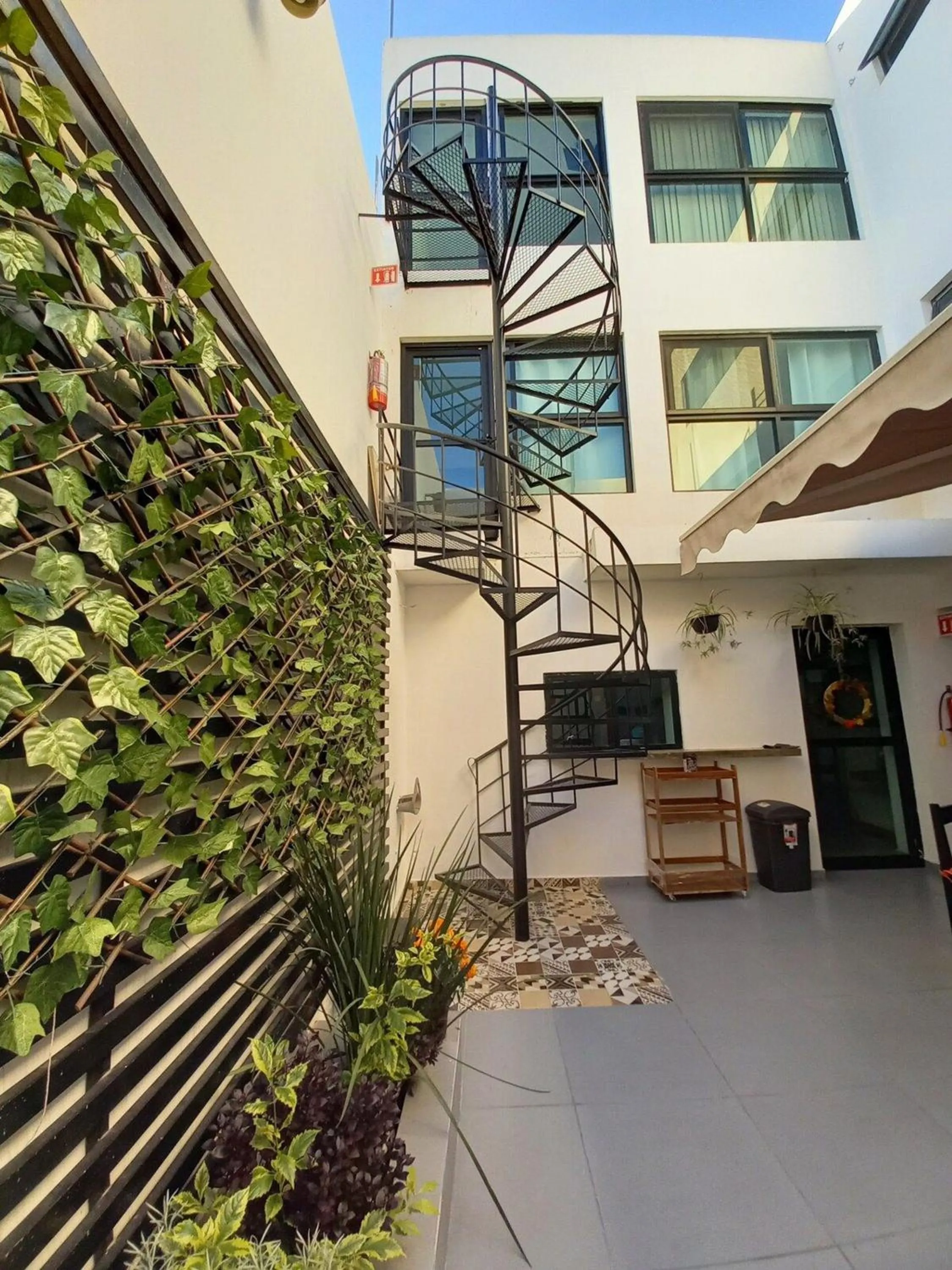 Property building in Capital O Tu Estancia