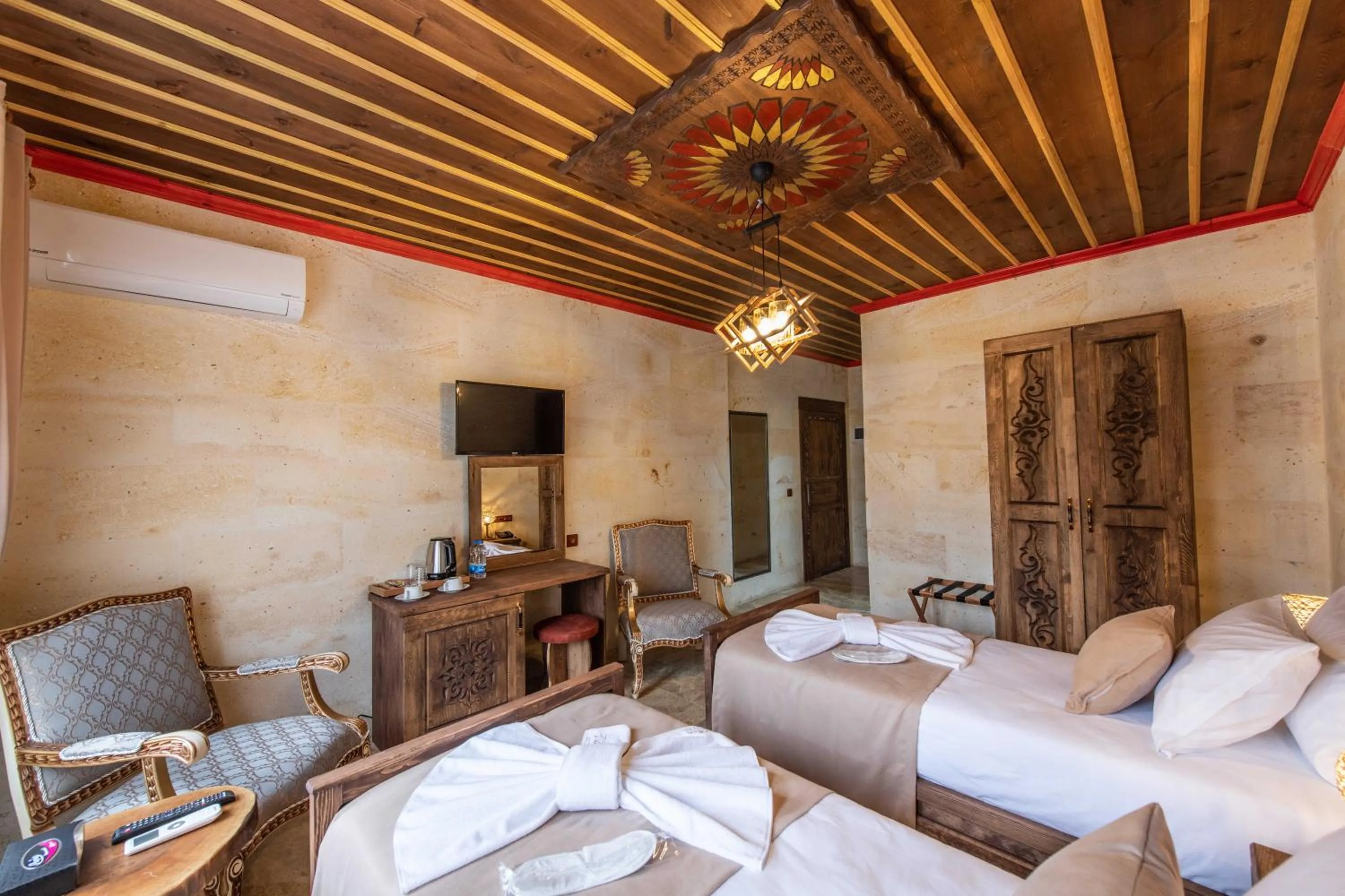 Bed in Volare Stone Hotel