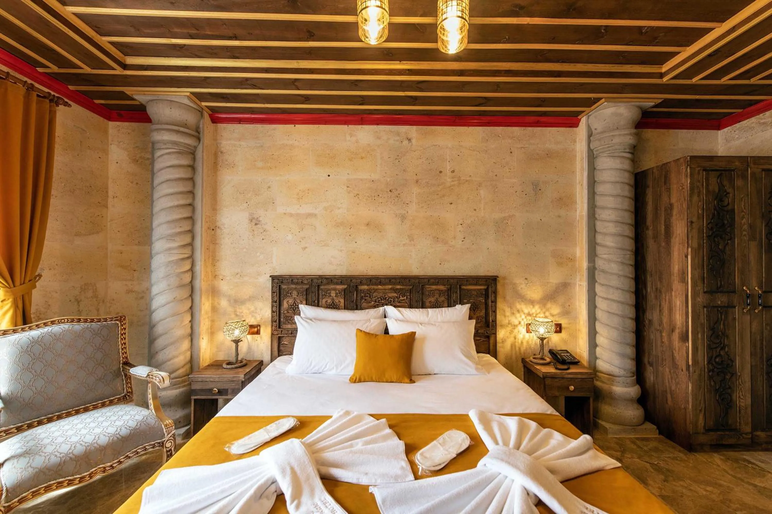 Bed in Volare Stone Hotel