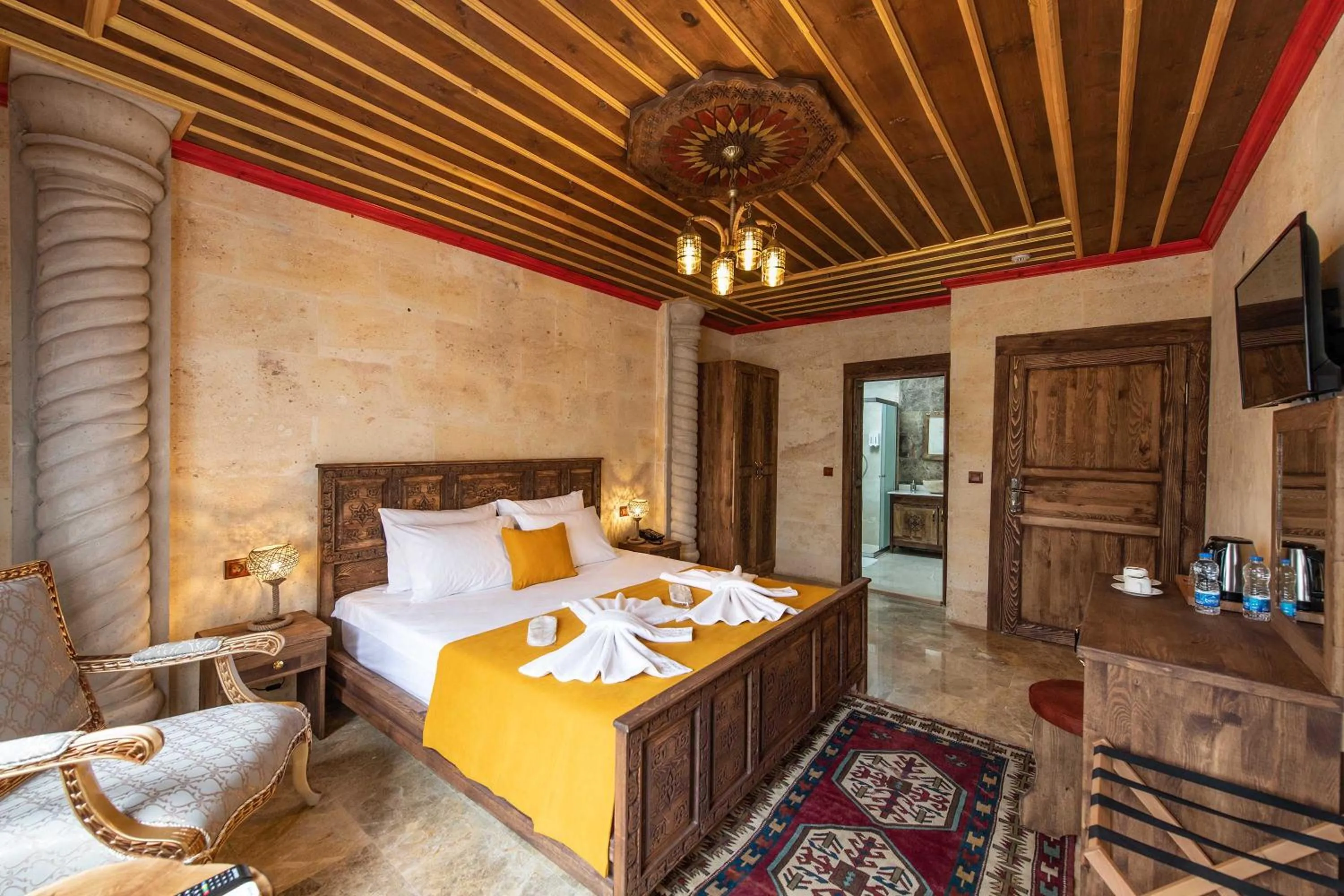 Bed in Volare Stone Hotel