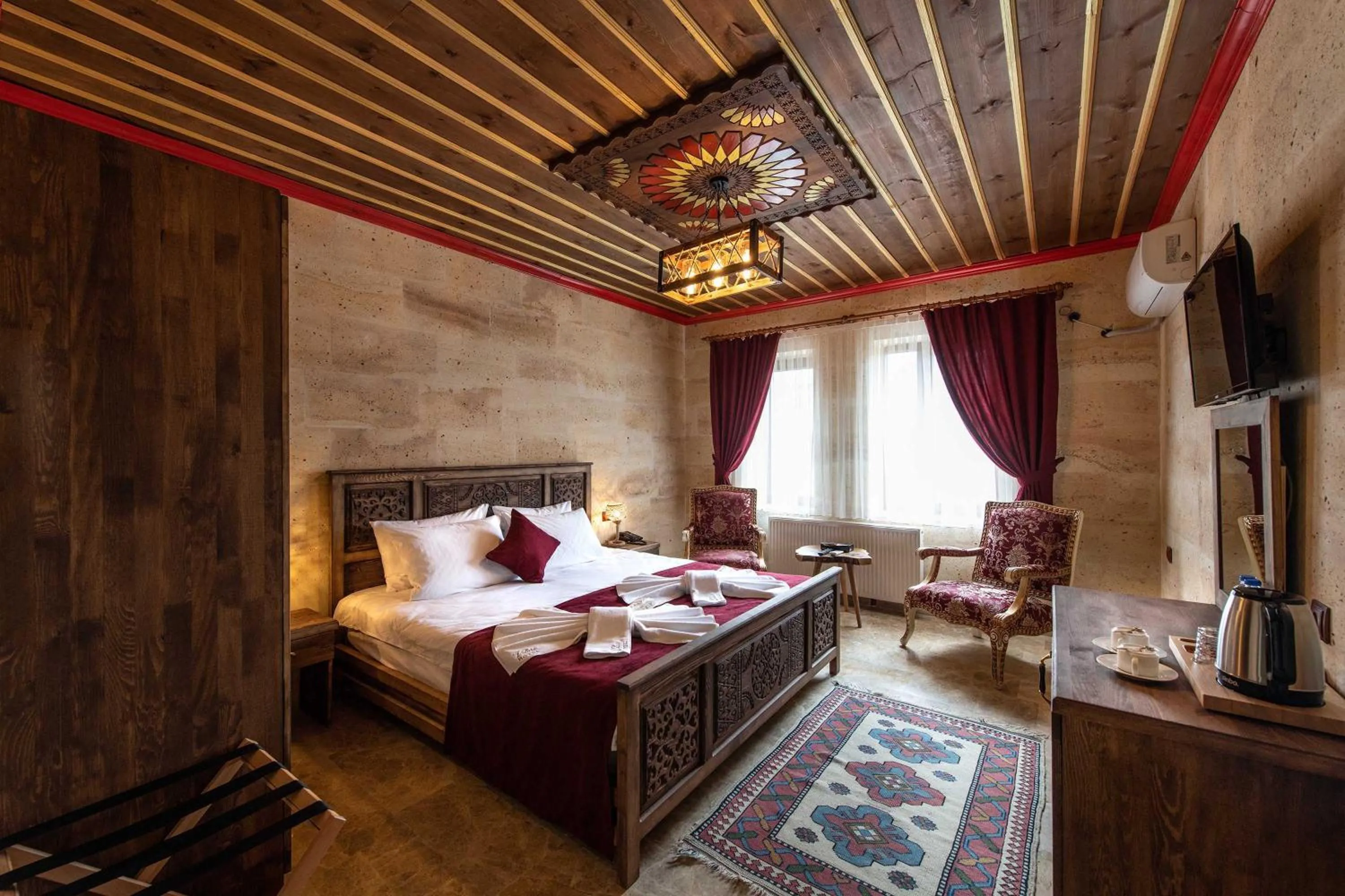 Bed in Volare Stone Hotel