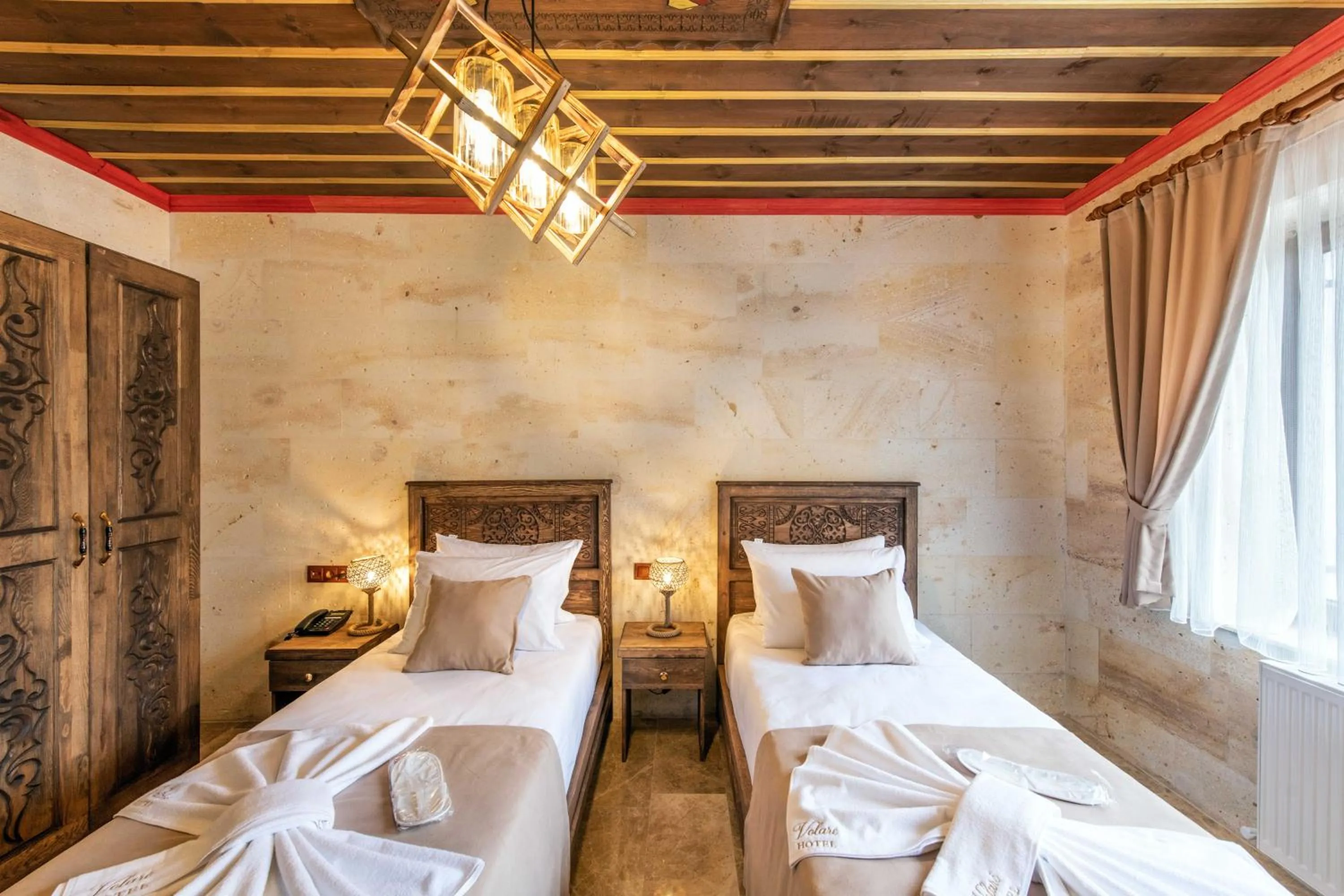 Bed in Volare Stone Hotel