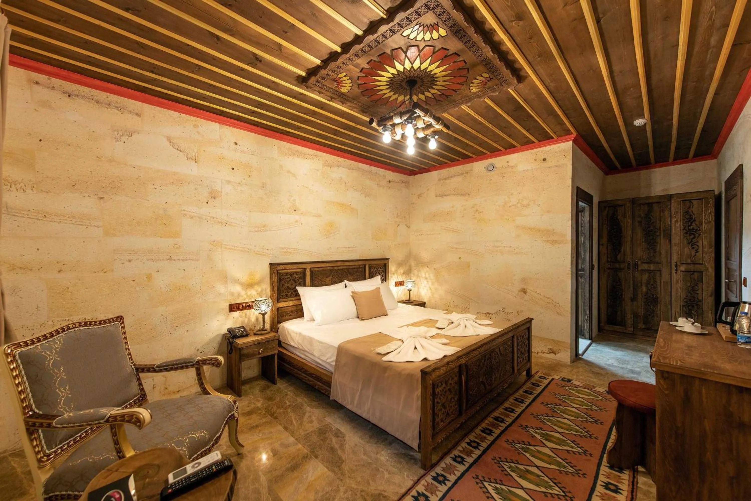 Bed in Volare Stone Hotel