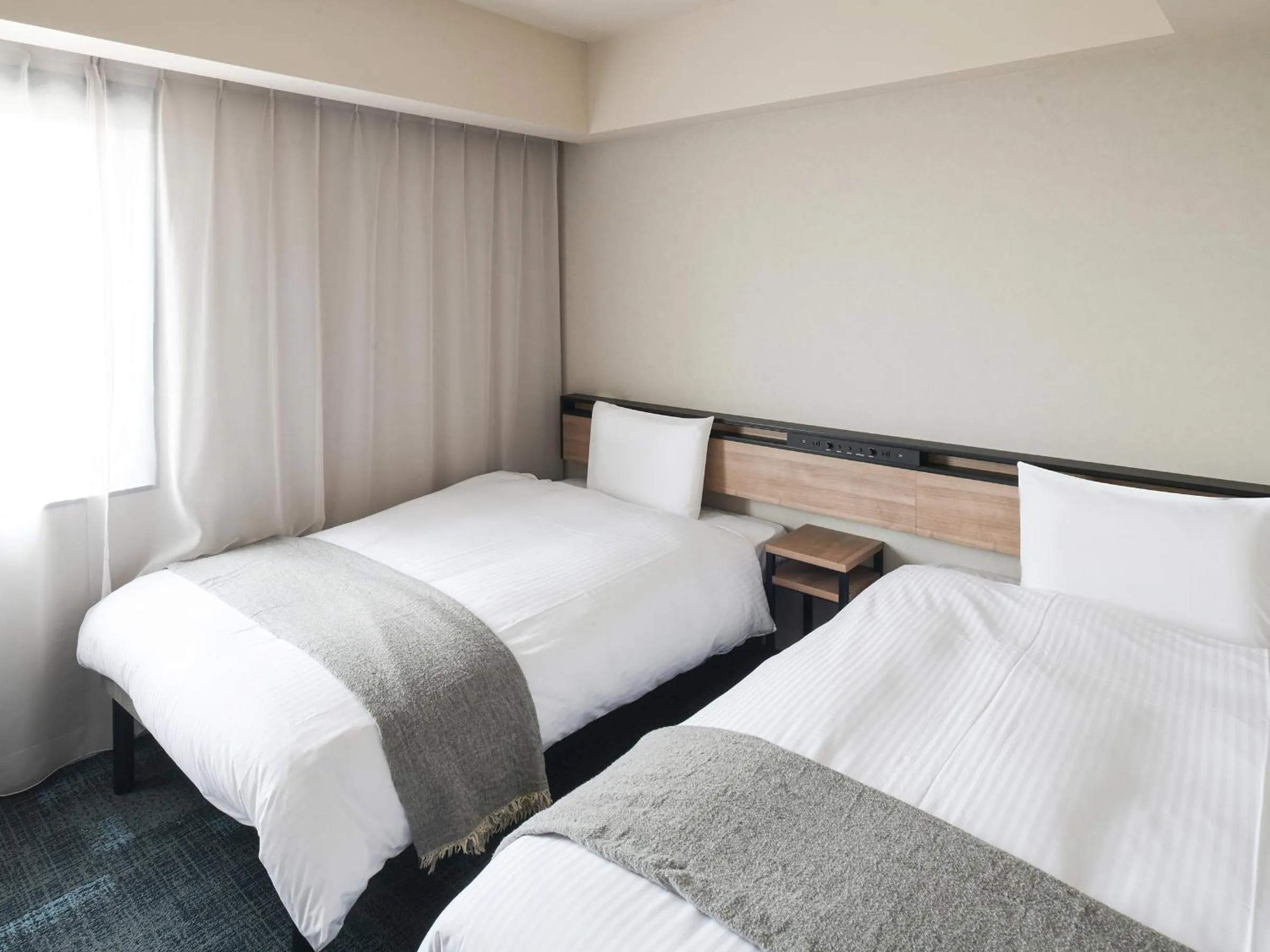 Bed in REF Kansai Airport by VESSEL HOTELS
