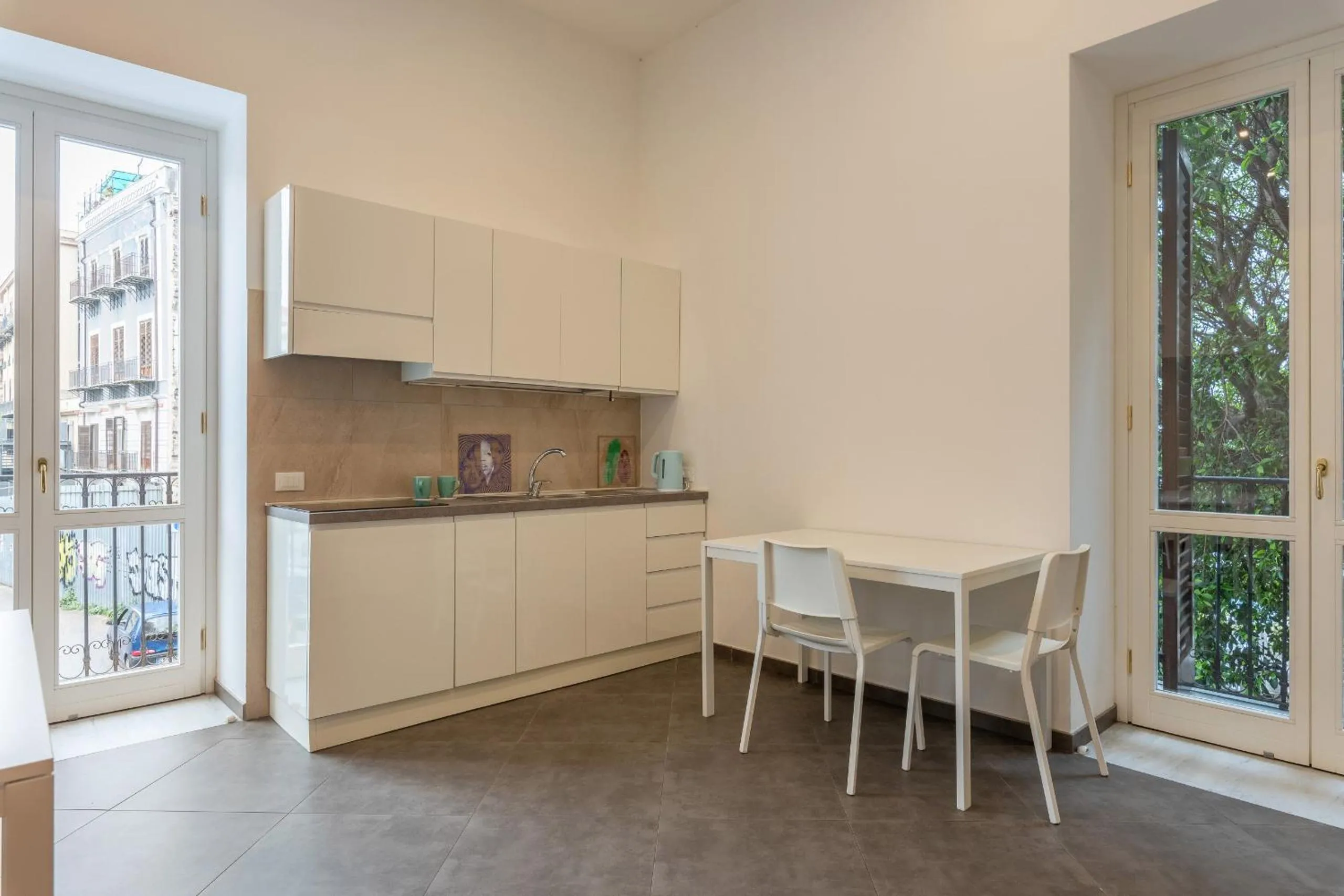 Kitchen or kitchenette in Apartments La Cala by Wonderful Italy