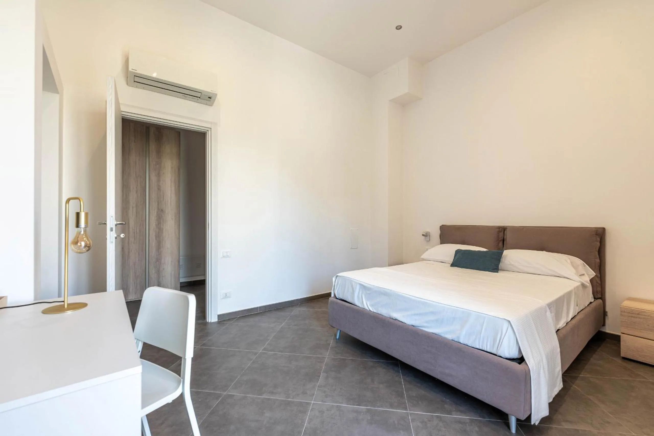 Bed in Apartments La Cala by Wonderful Italy