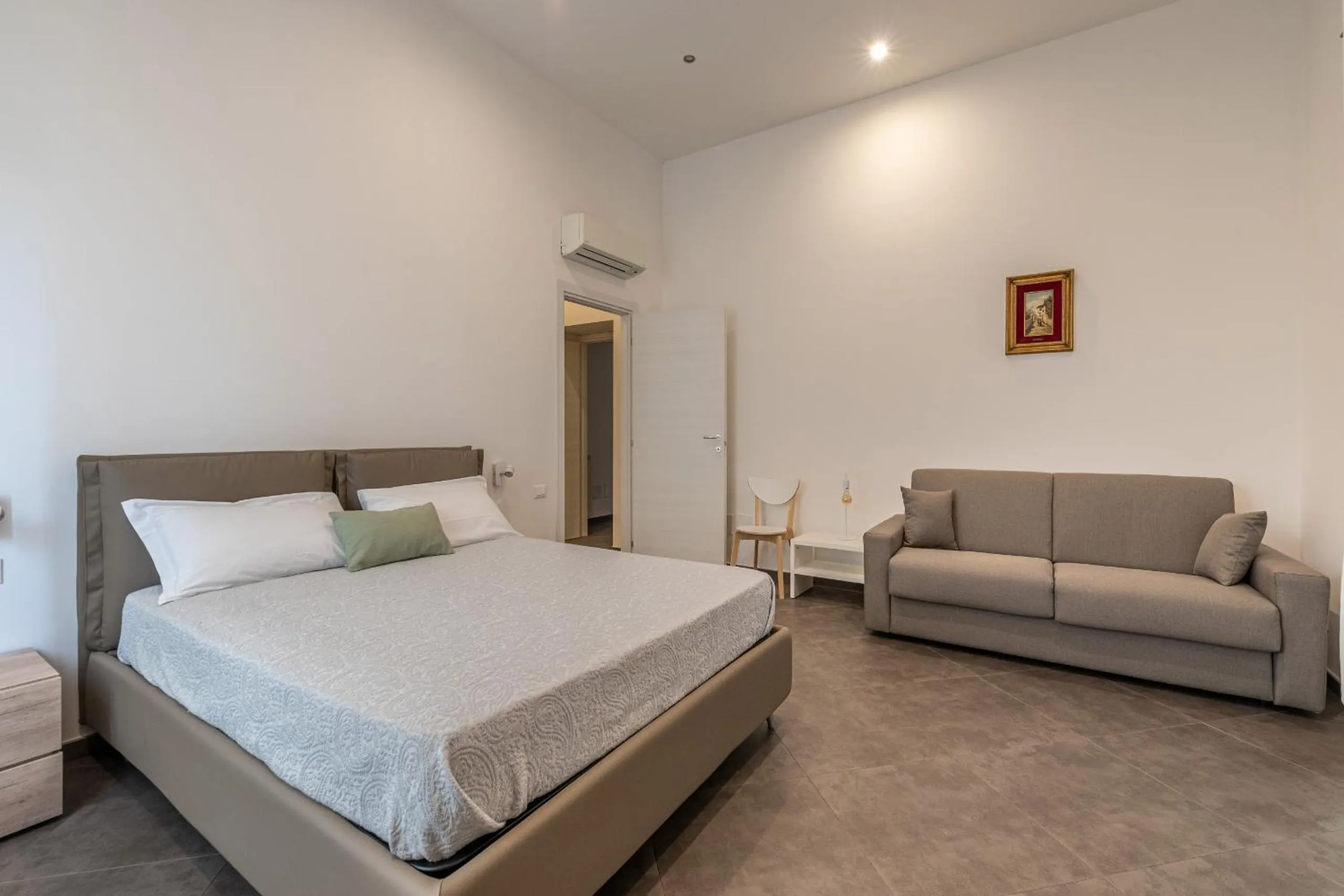 Bed in Apartments La Cala by Wonderful Italy