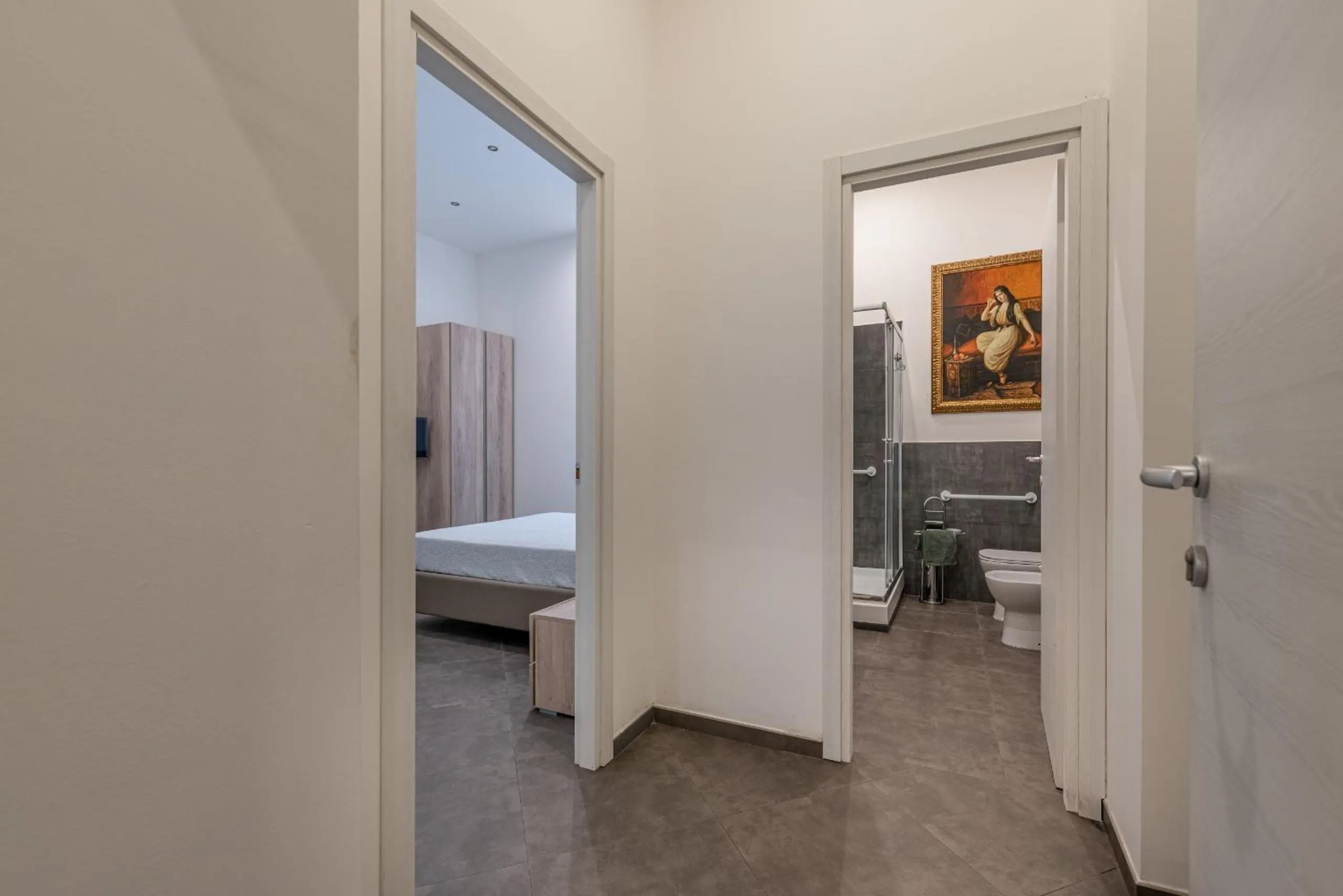Bathroom, Bed in Apartments La Cala by Wonderful Italy