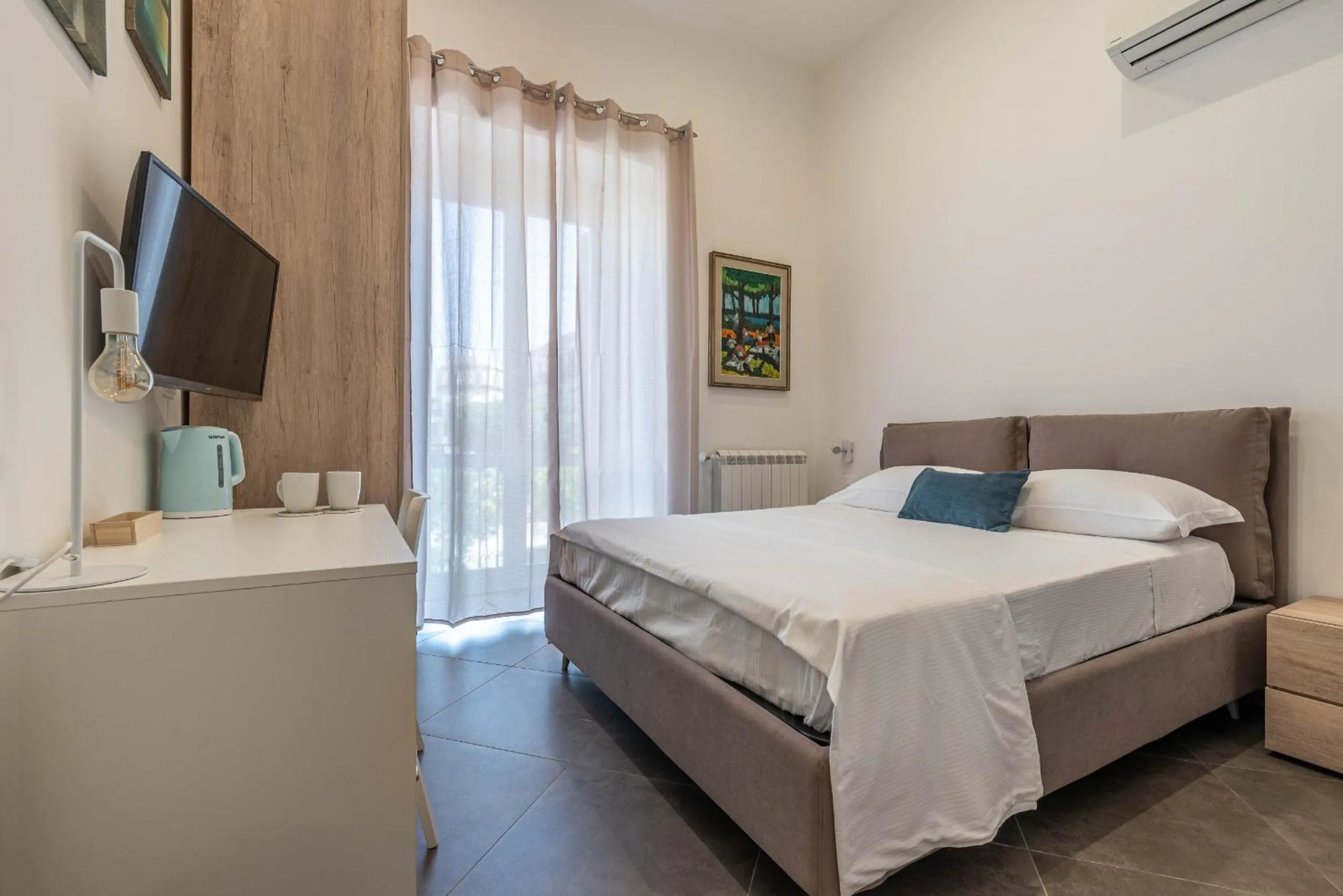 Bed in Apartments La Cala by Wonderful Italy