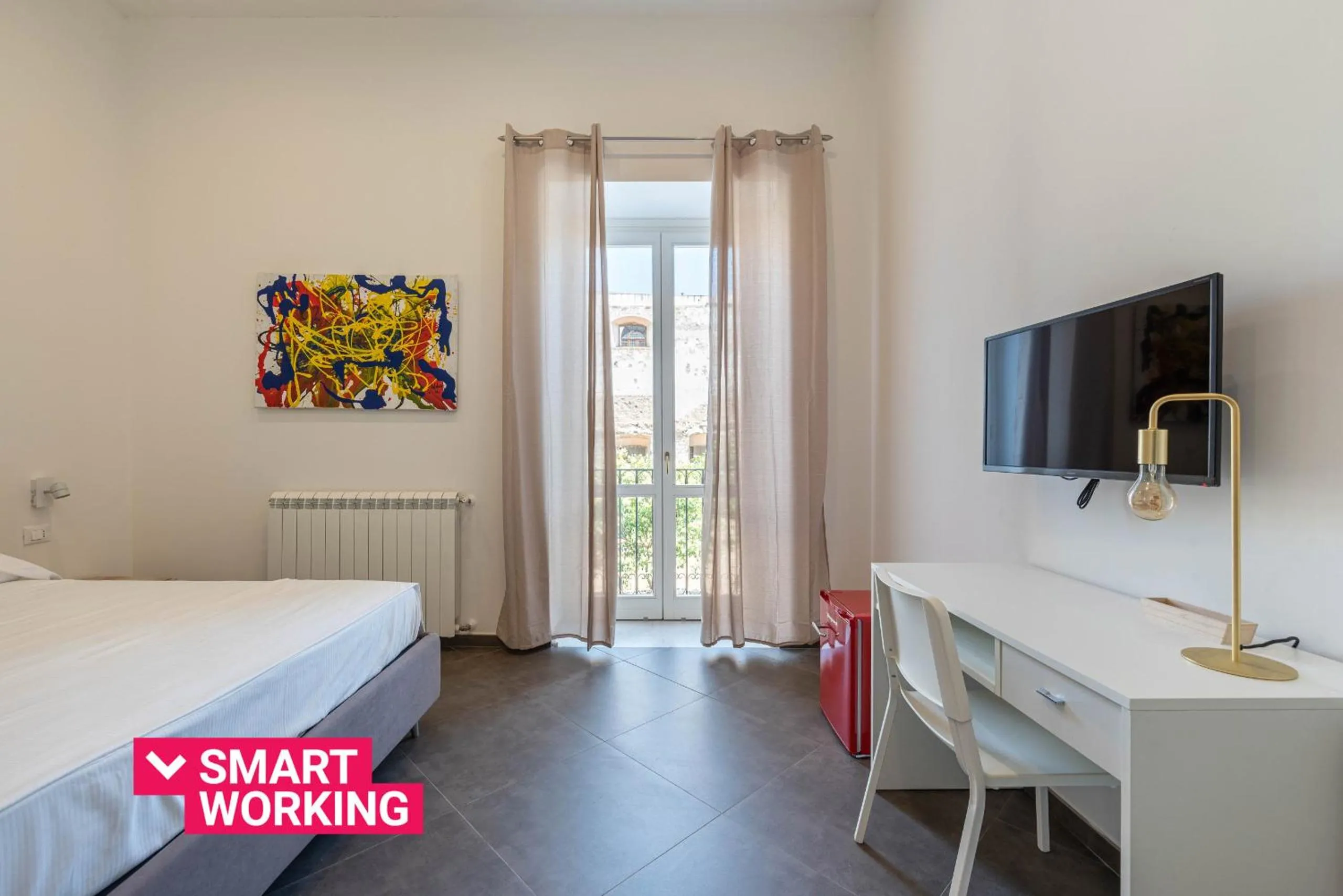Bed in Apartments La Cala by Wonderful Italy