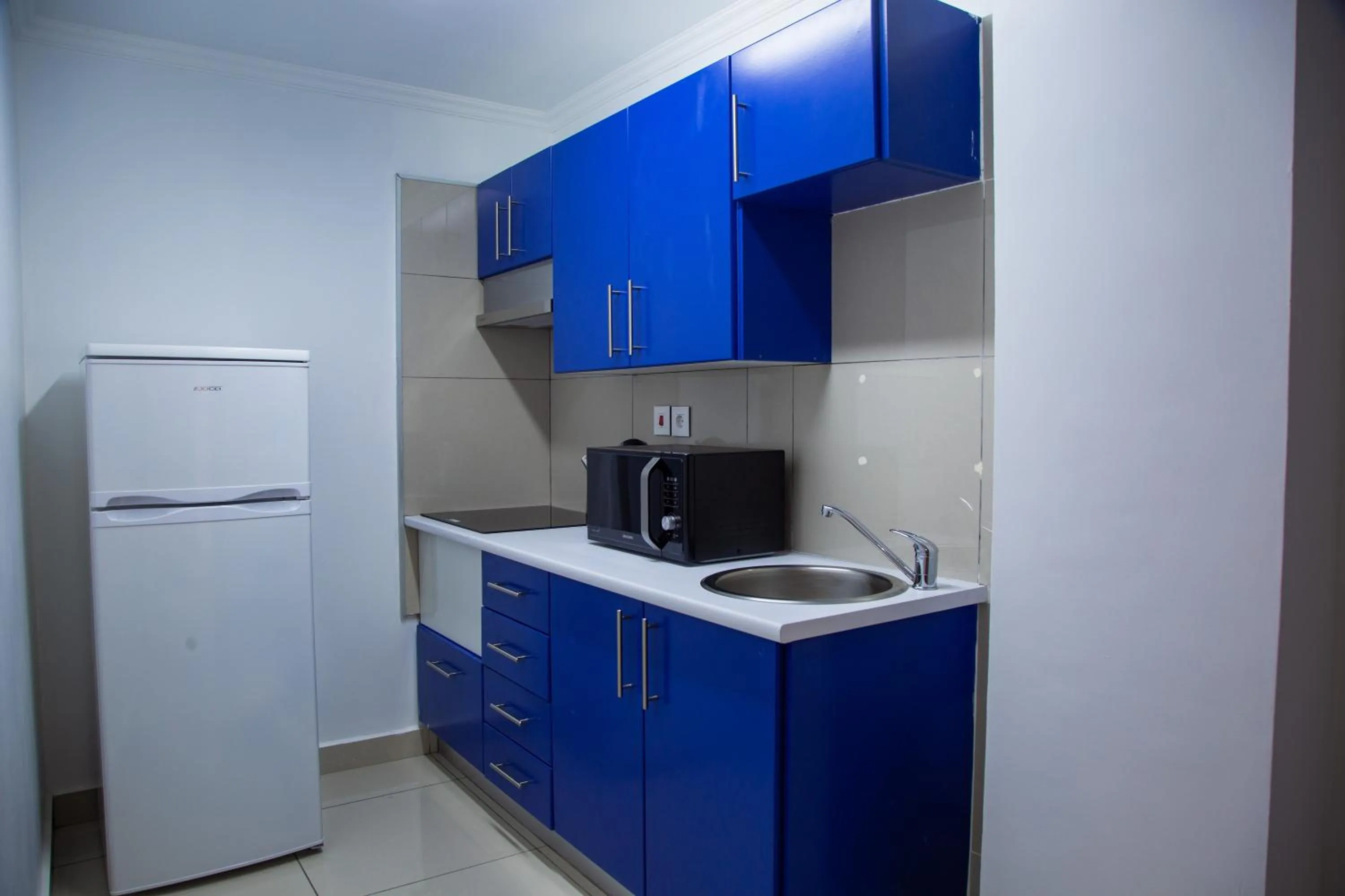 Kitchen or kitchenette in WDC APARTHOTEL - BUEA