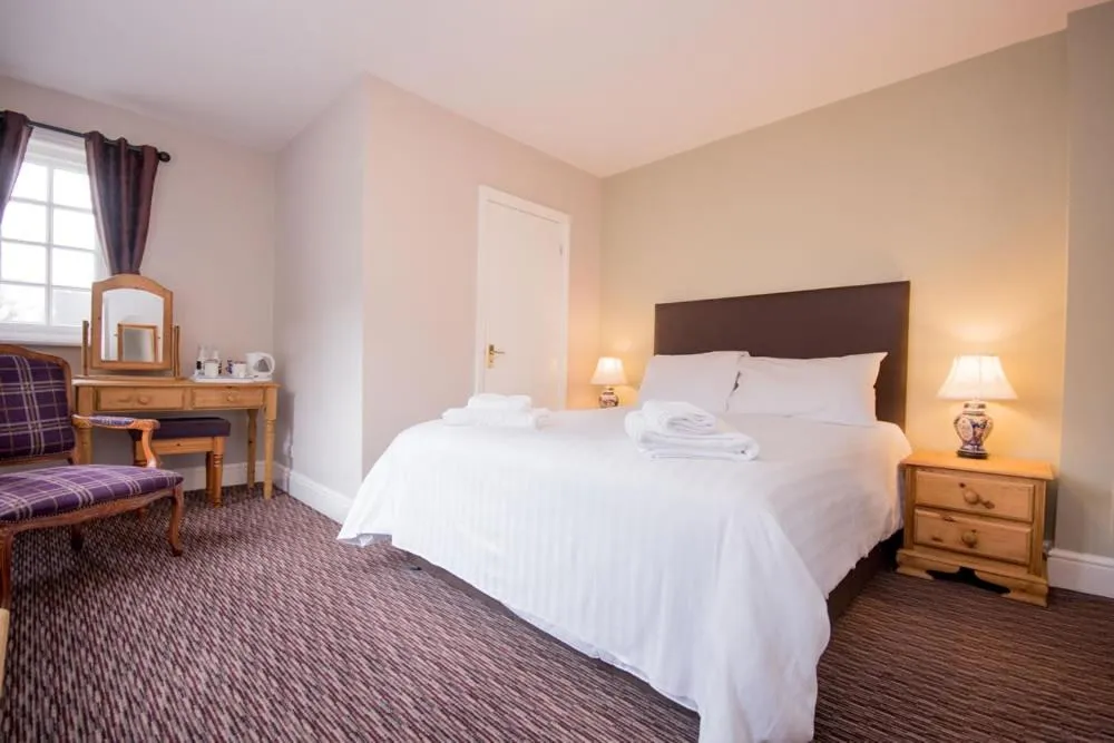 Bed in The Burley Inn