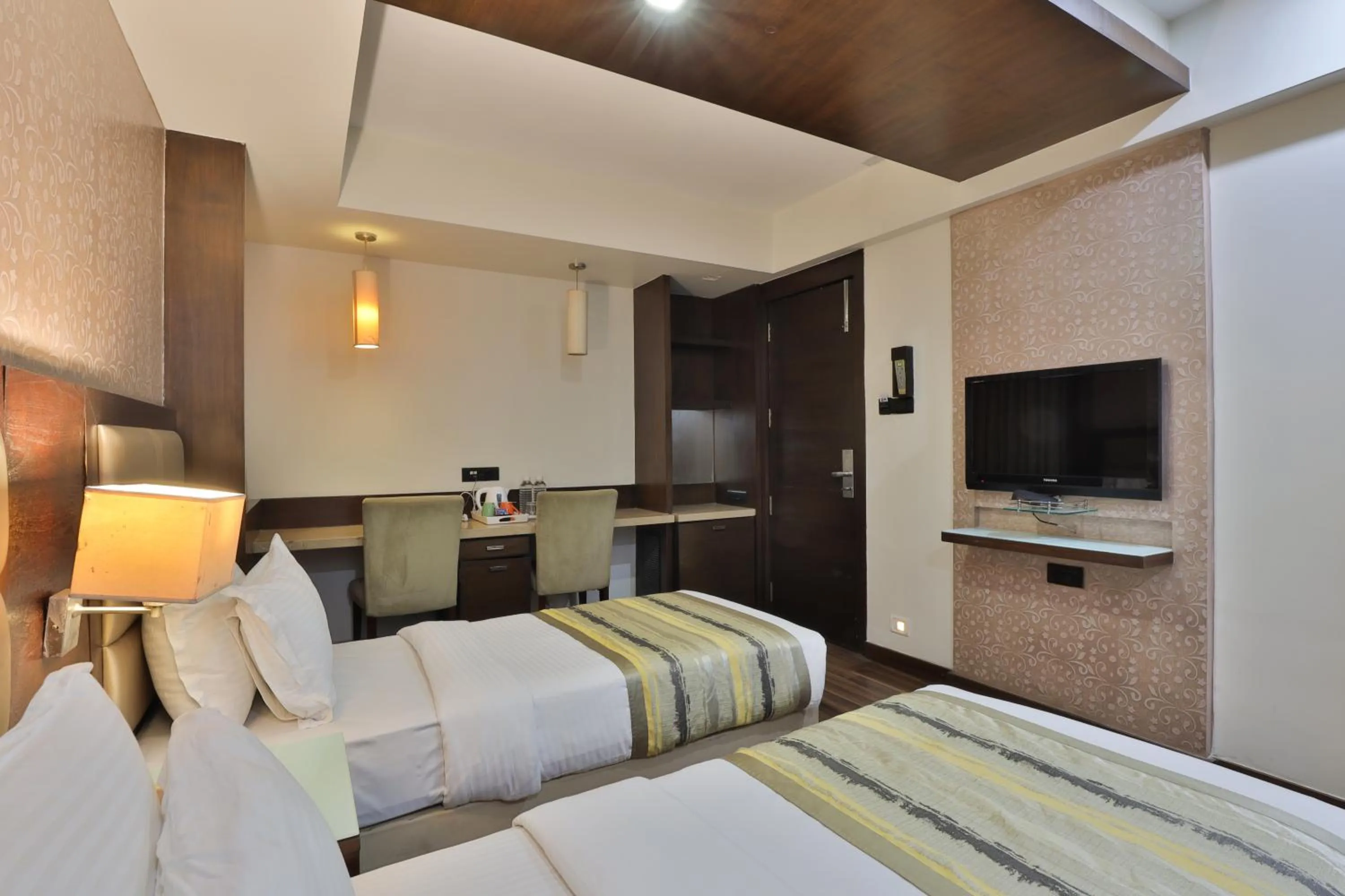 TV and multimedia, Bed in Krios Hotel - Near SG Highway, Ahmedabad