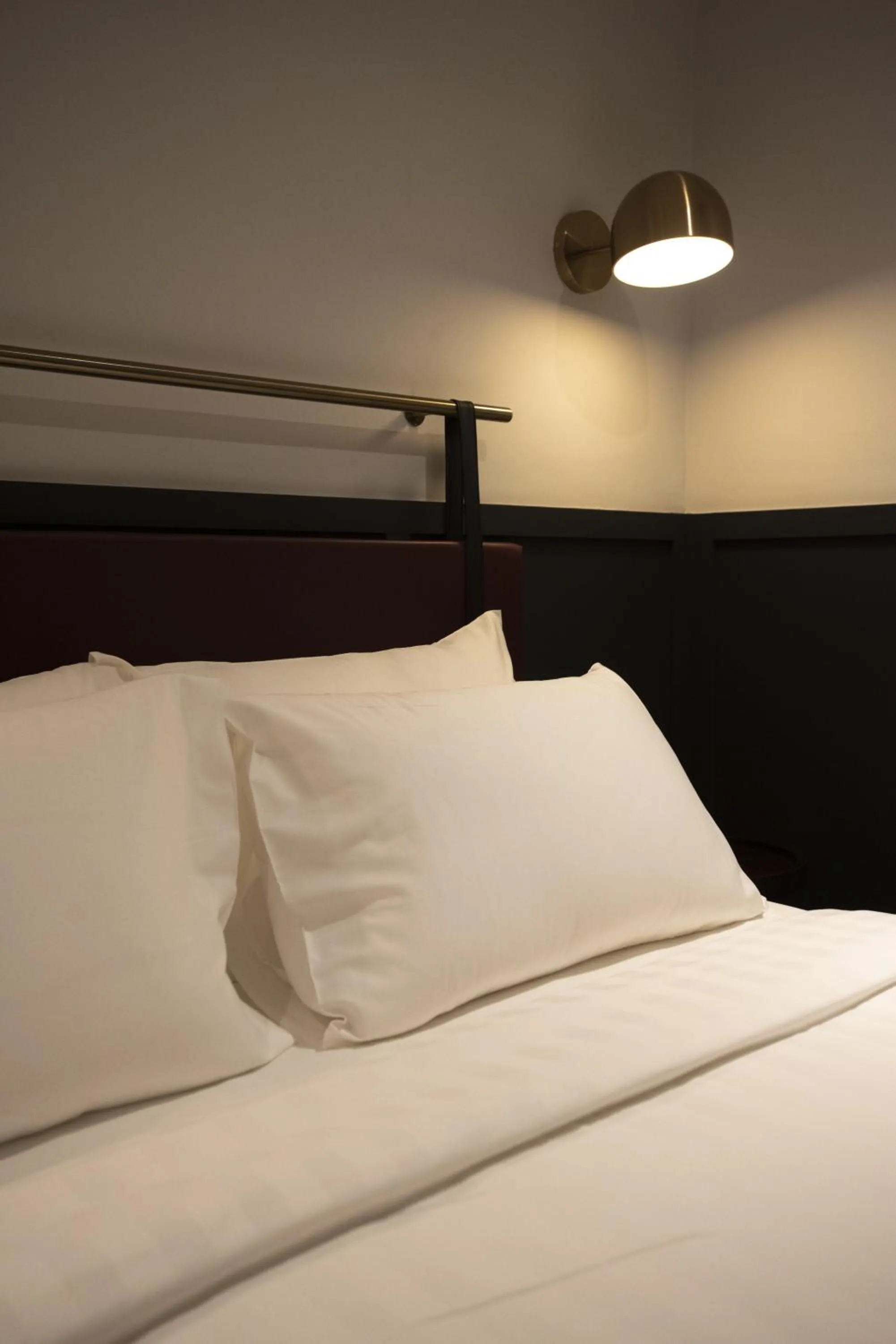 Bed in Monocolo Boutique Hotel