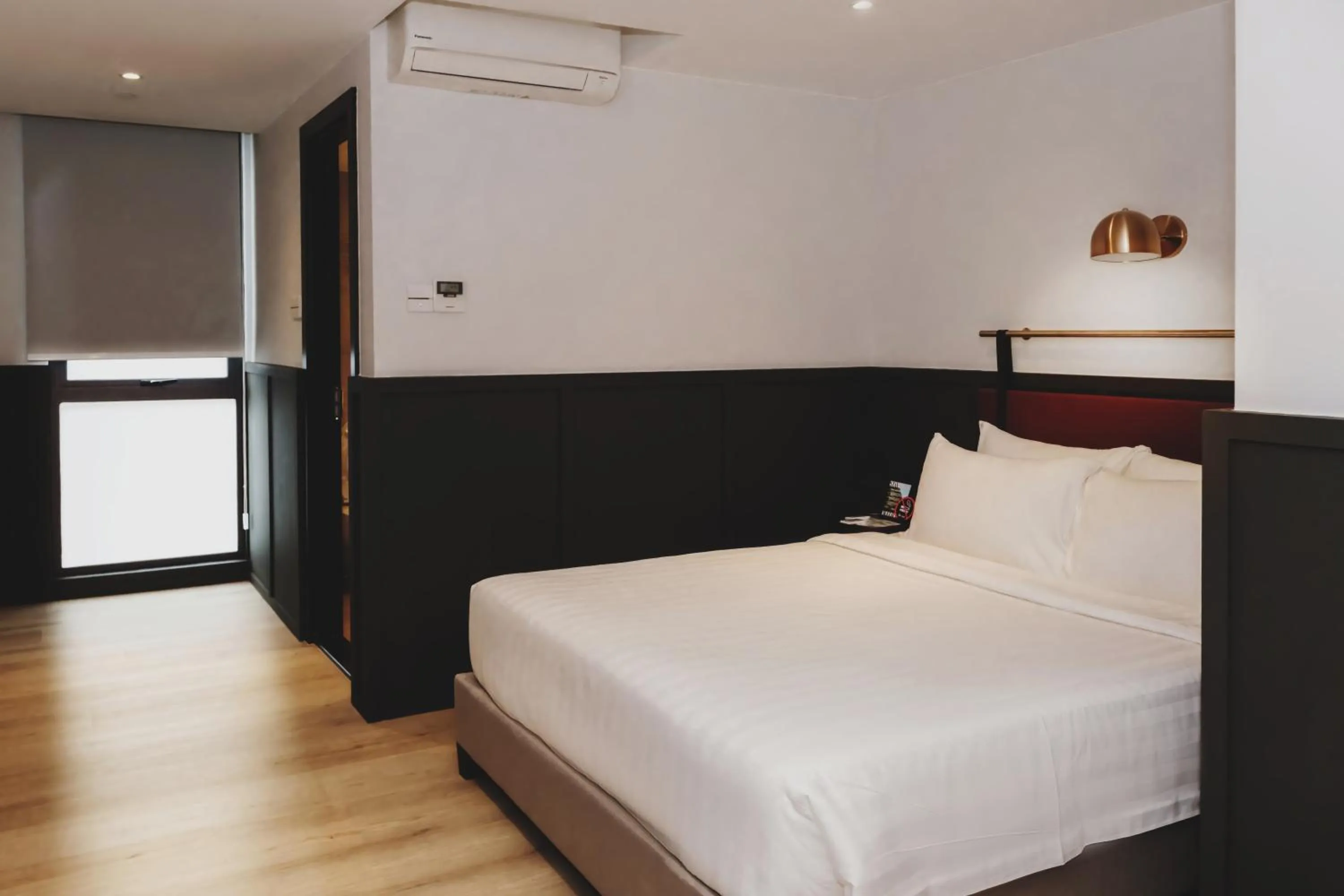 Bed in Monocolo Boutique Hotel