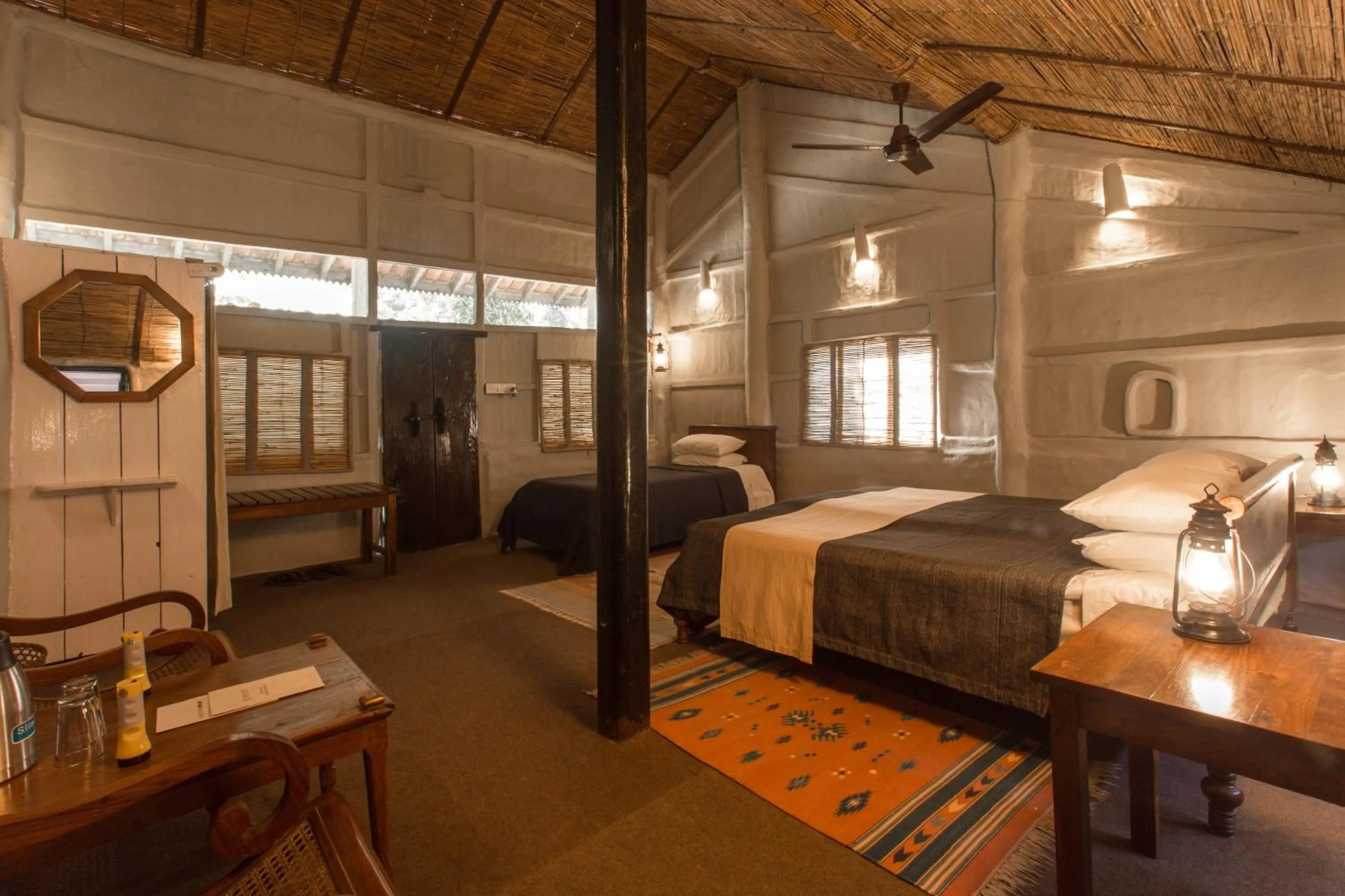 Photo of the whole room, Bed in Tiger Tops Tharu Lodge