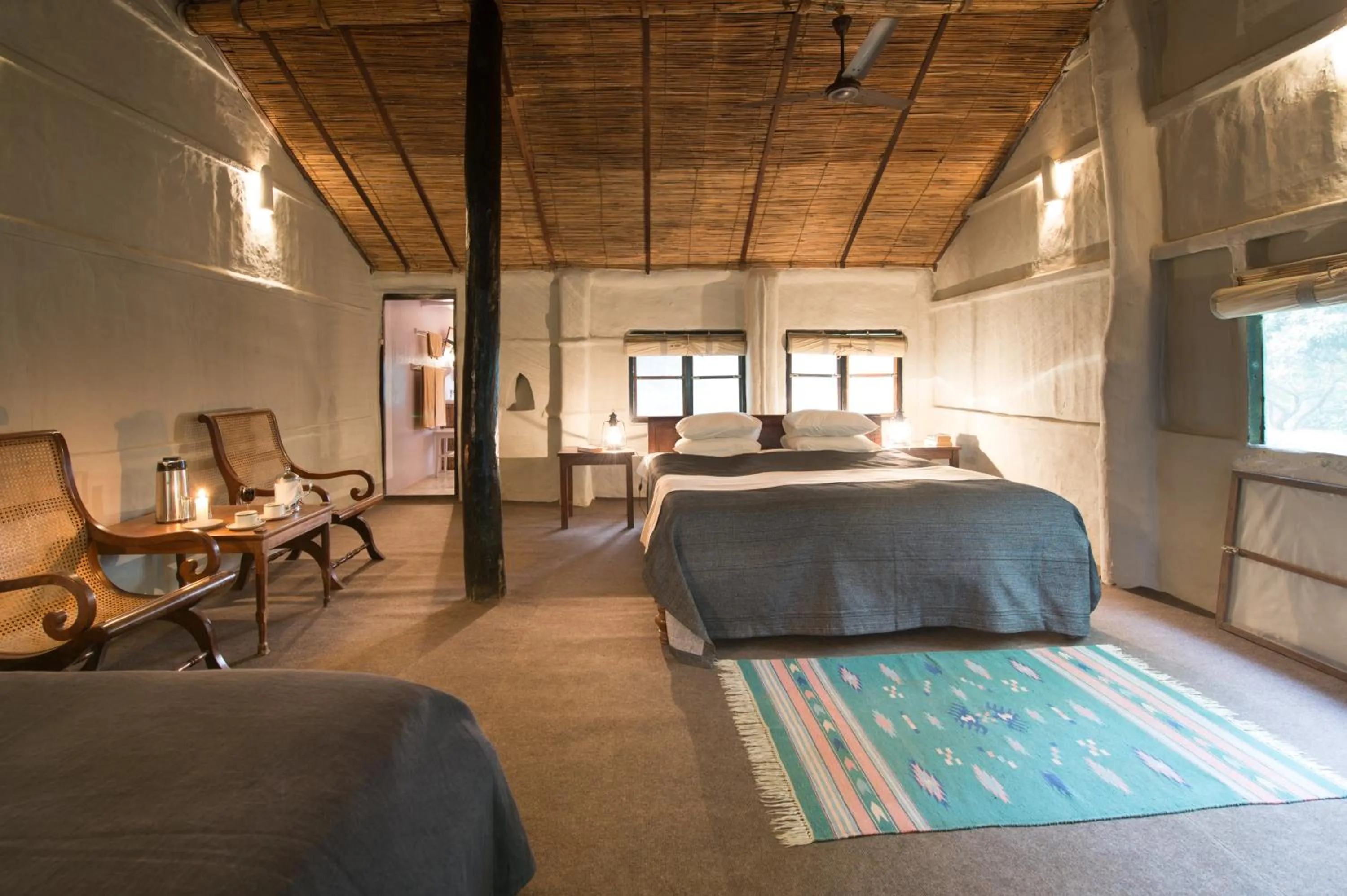 Photo of the whole room, Bed in Tiger Tops Tharu Lodge