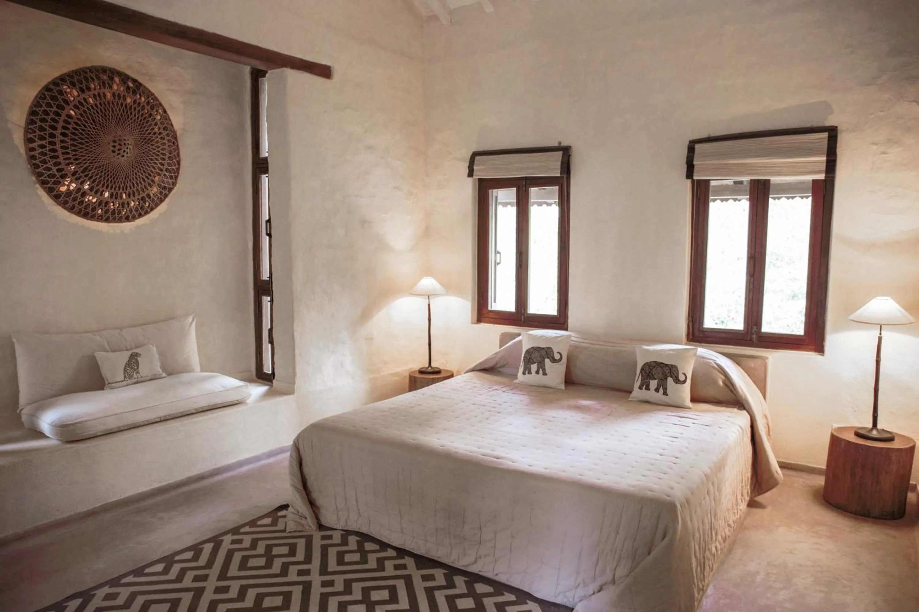 Bed in Tiger Tops Karnali Lodge