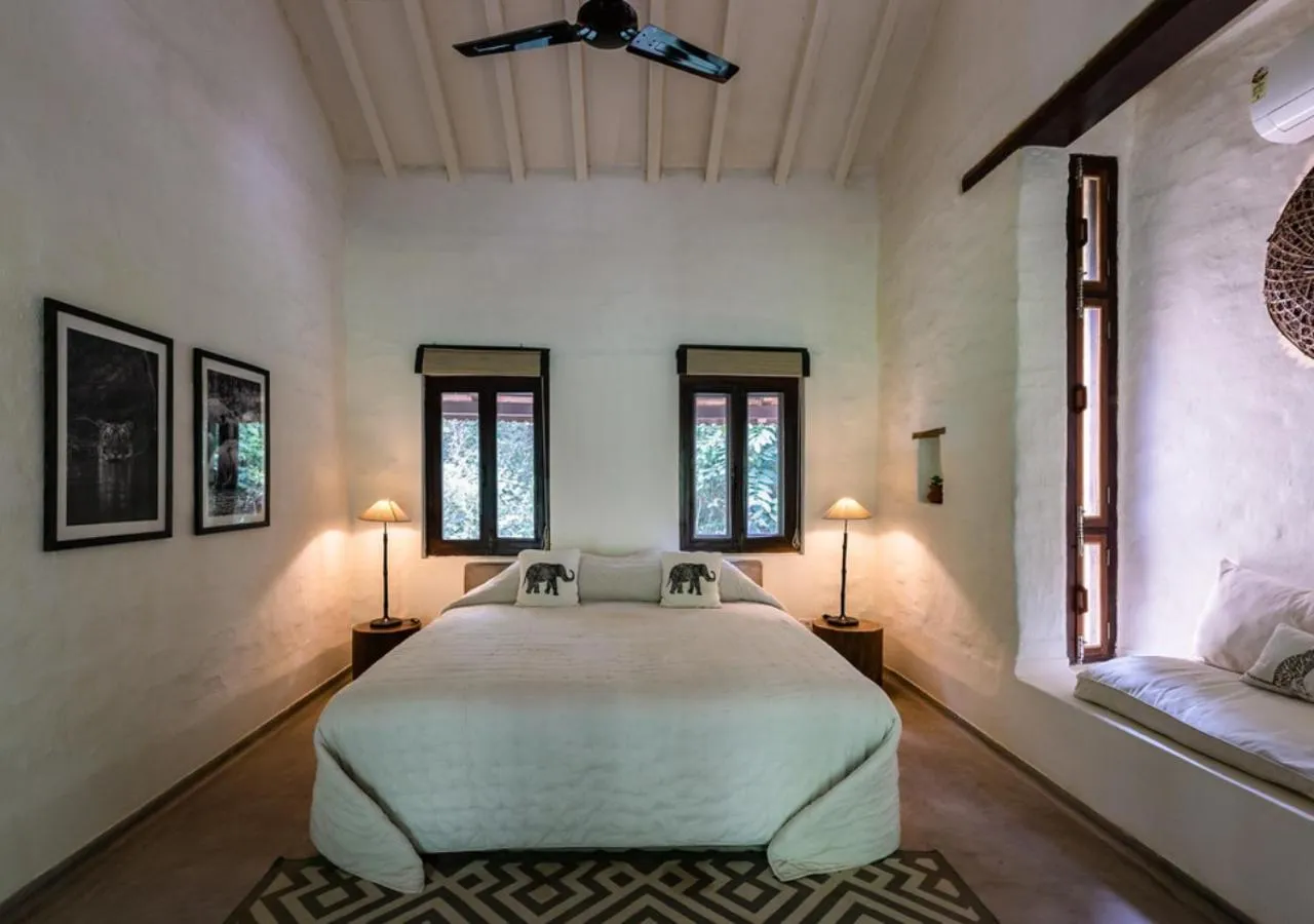 Bed in Tiger Tops Karnali Lodge