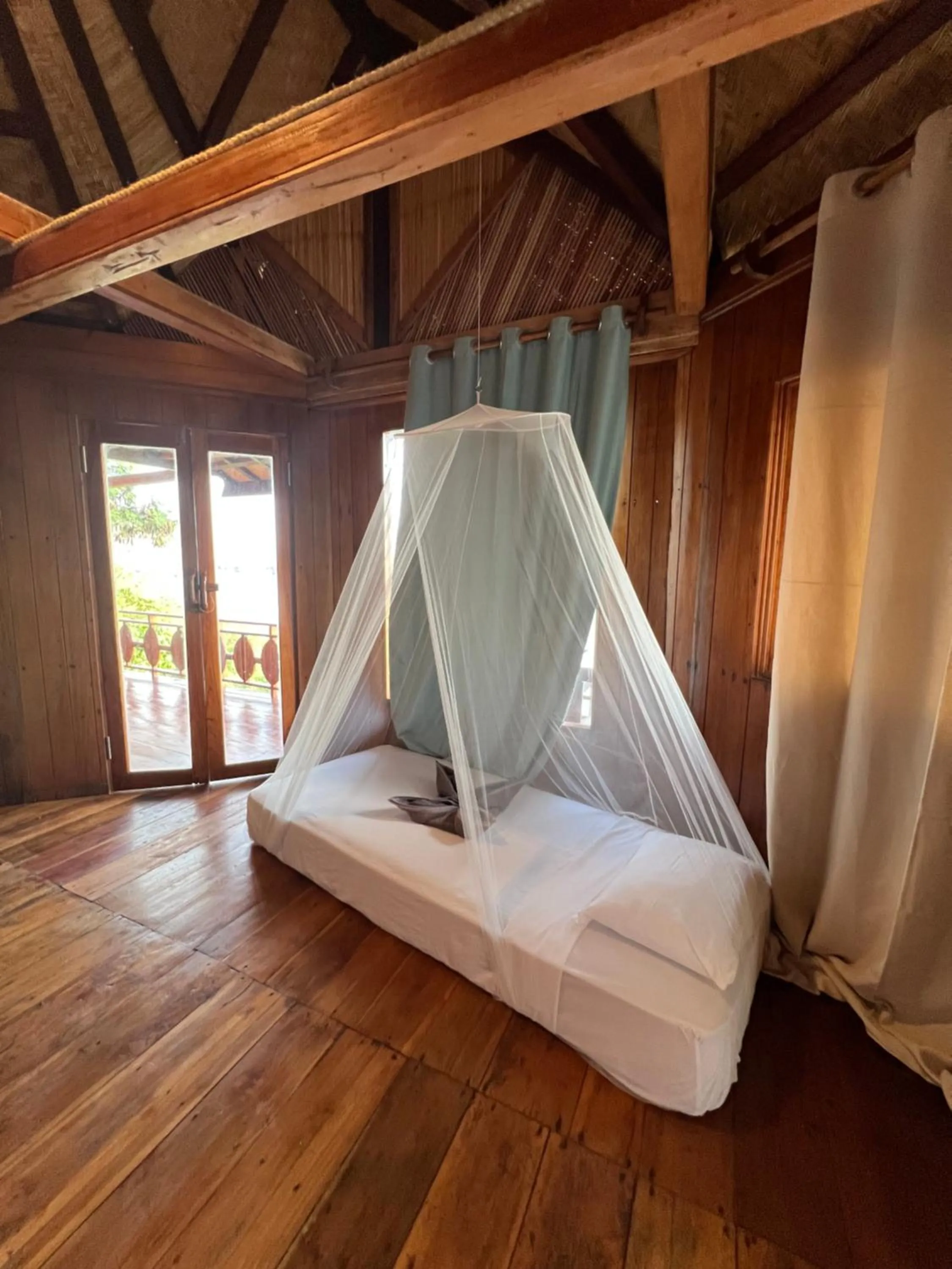 Bed in Waecicu Eden Beach Hotel