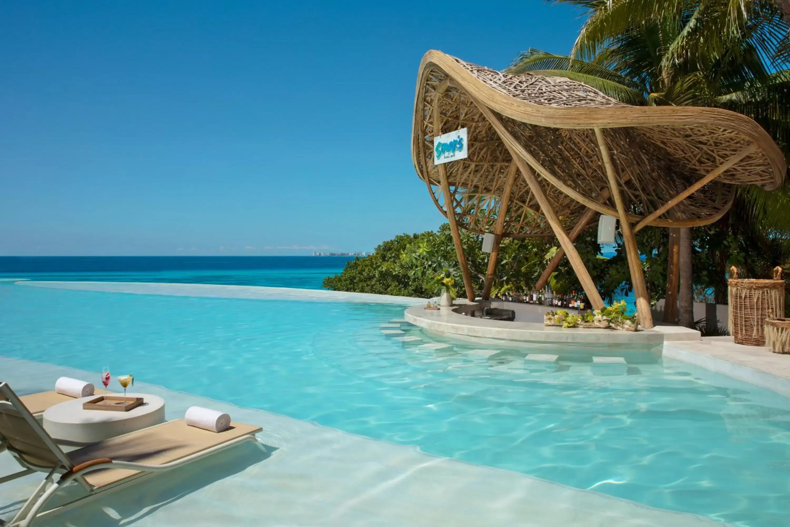 Swimming pool in Impression Isla Mujeres by Secrets - Adults Only - All Inclusive Swimming pool in Impression Isla Mujeres by Secrets - Adults Only - All Inclusive