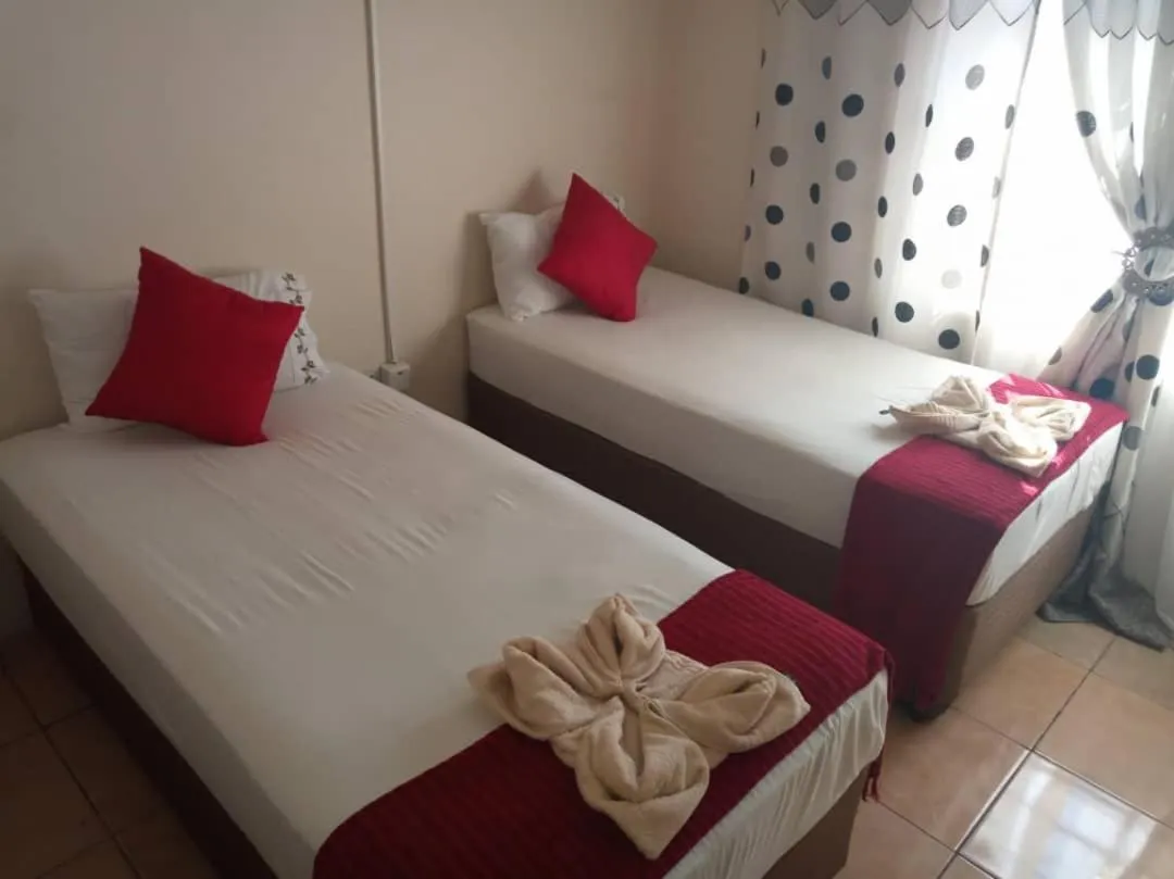 Bed in DEN VIEW GUESTHOUSE