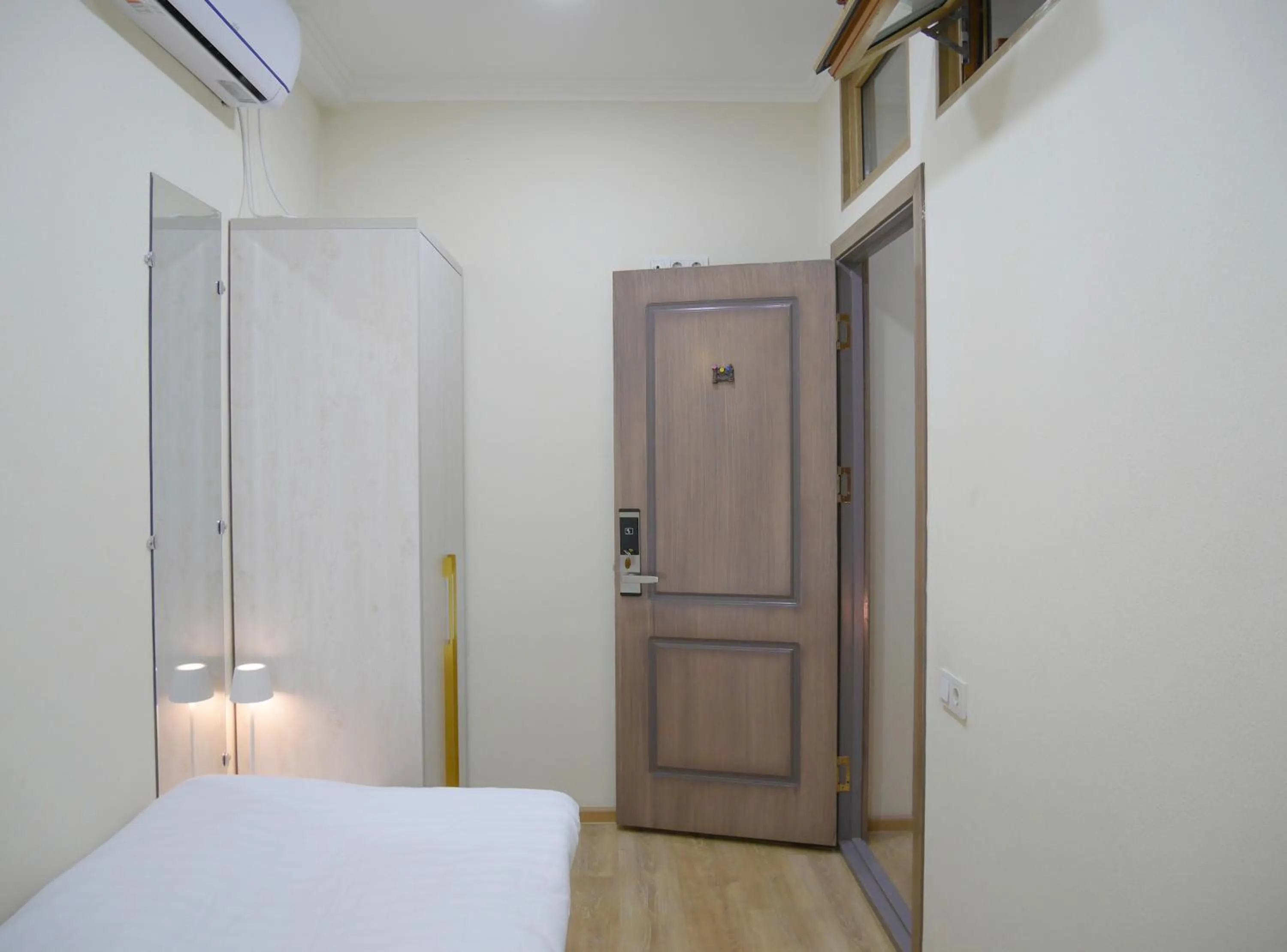 Photo of the whole room, Bed in Oasis Boutique