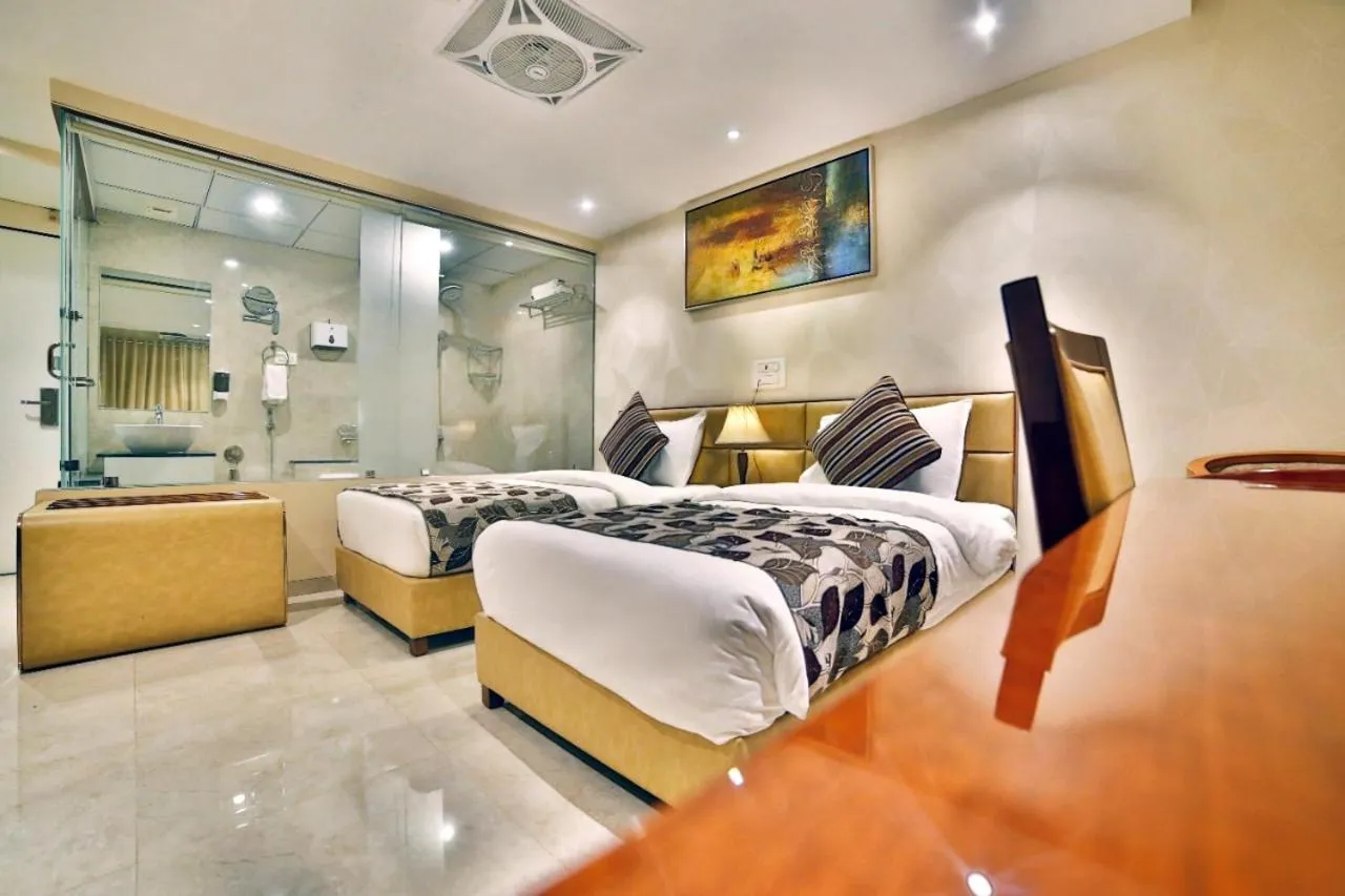 Bed in Hotel Kings Heritage Surat