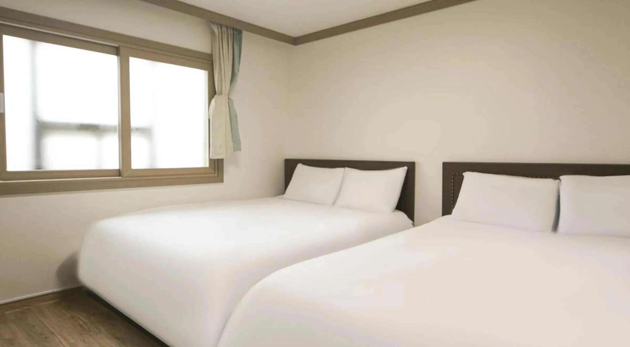 Bed in Top Island Hotel