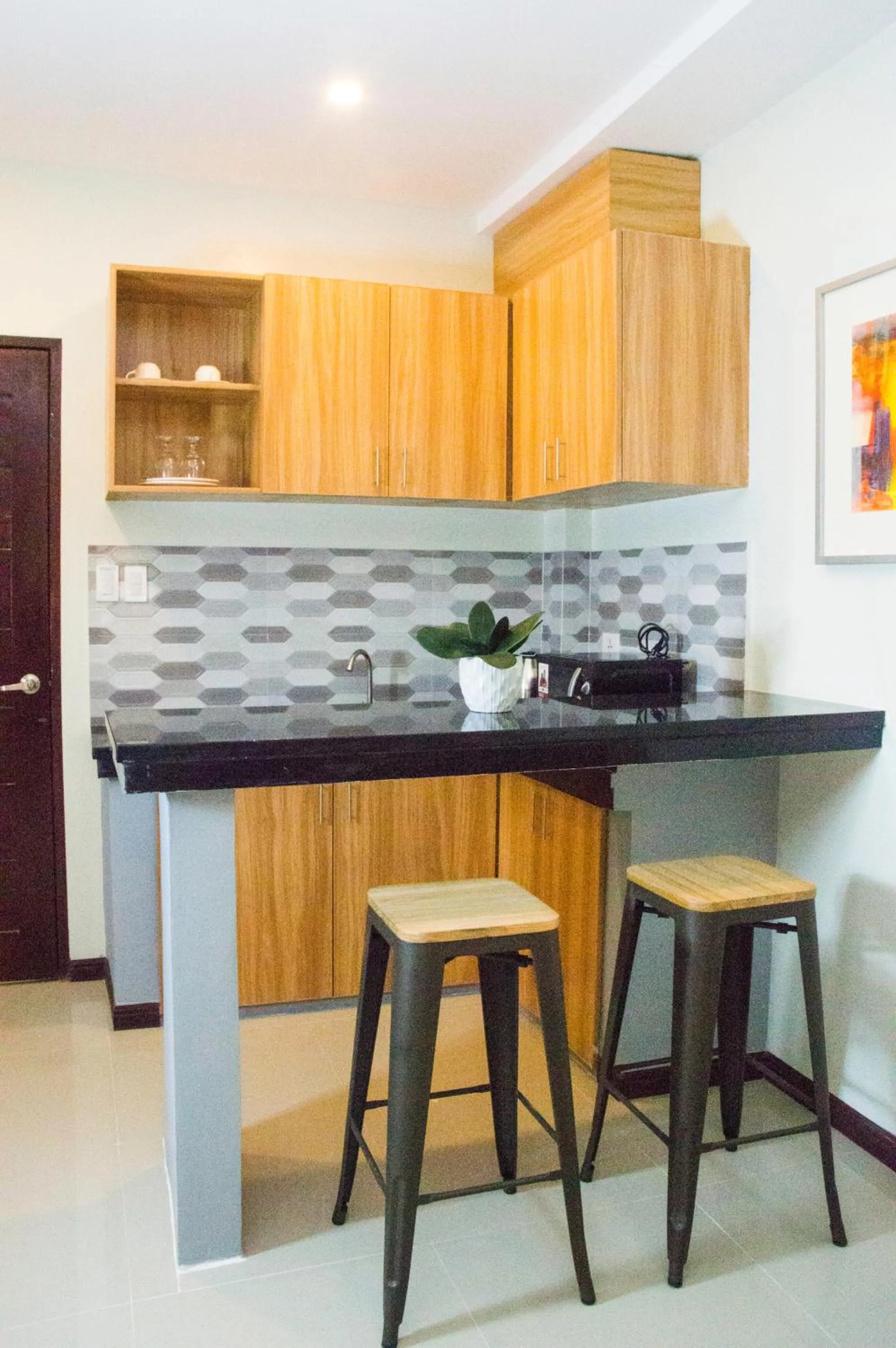 Kitchen or kitchenette in ELTI SUITES By Bluebookers
