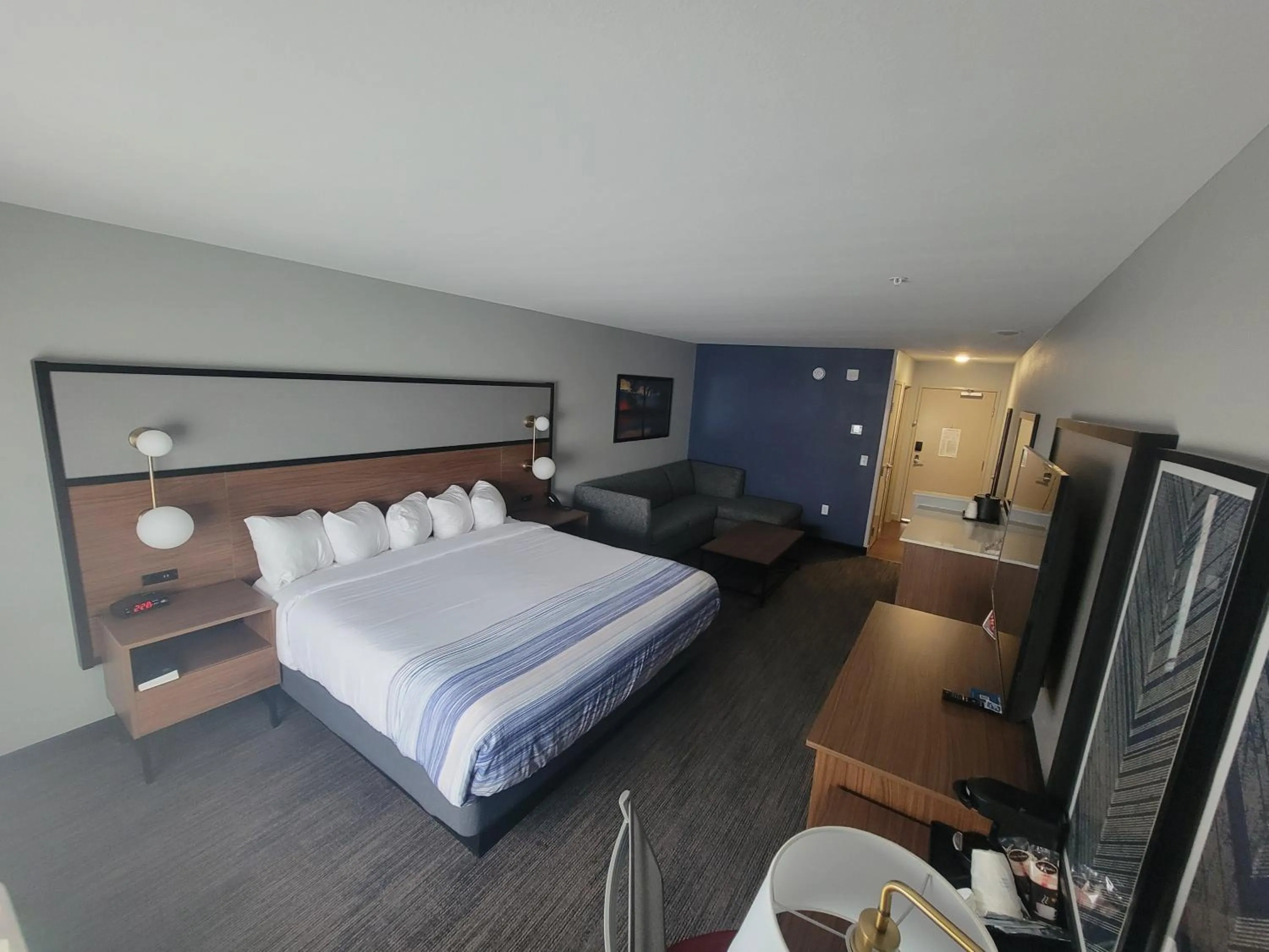 Seating area, Bed in AmericInn by Wyndham International Falls